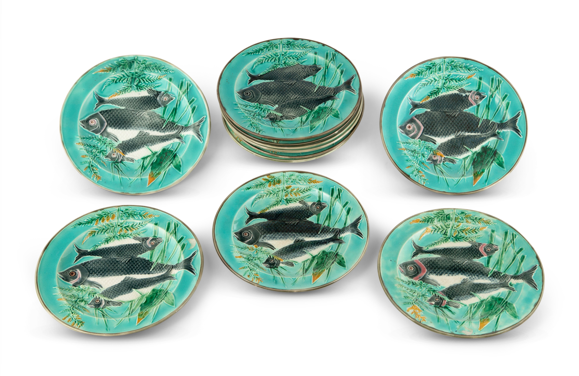 Lot image - Eleven Josiah Wedgwood & Sons Majolica Turquoise-Ground Triple Fish Trout Plates