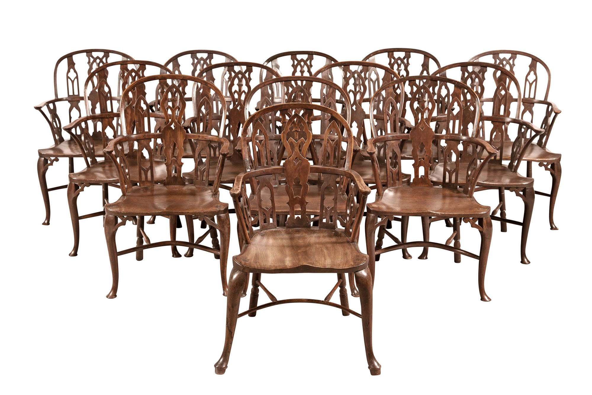 Lot image - Assembled Set of Twelve Mahogany and Yewwood Windsor Armchairs