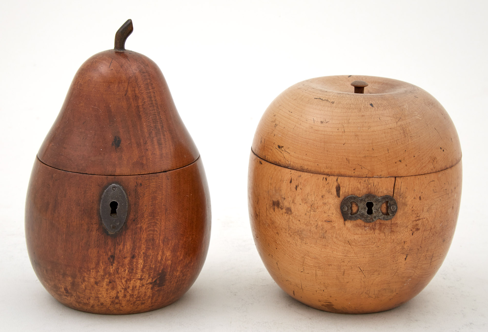 Lot image - Two George III Fruitwood Pear-Form and Apple-Form Tea Caddies