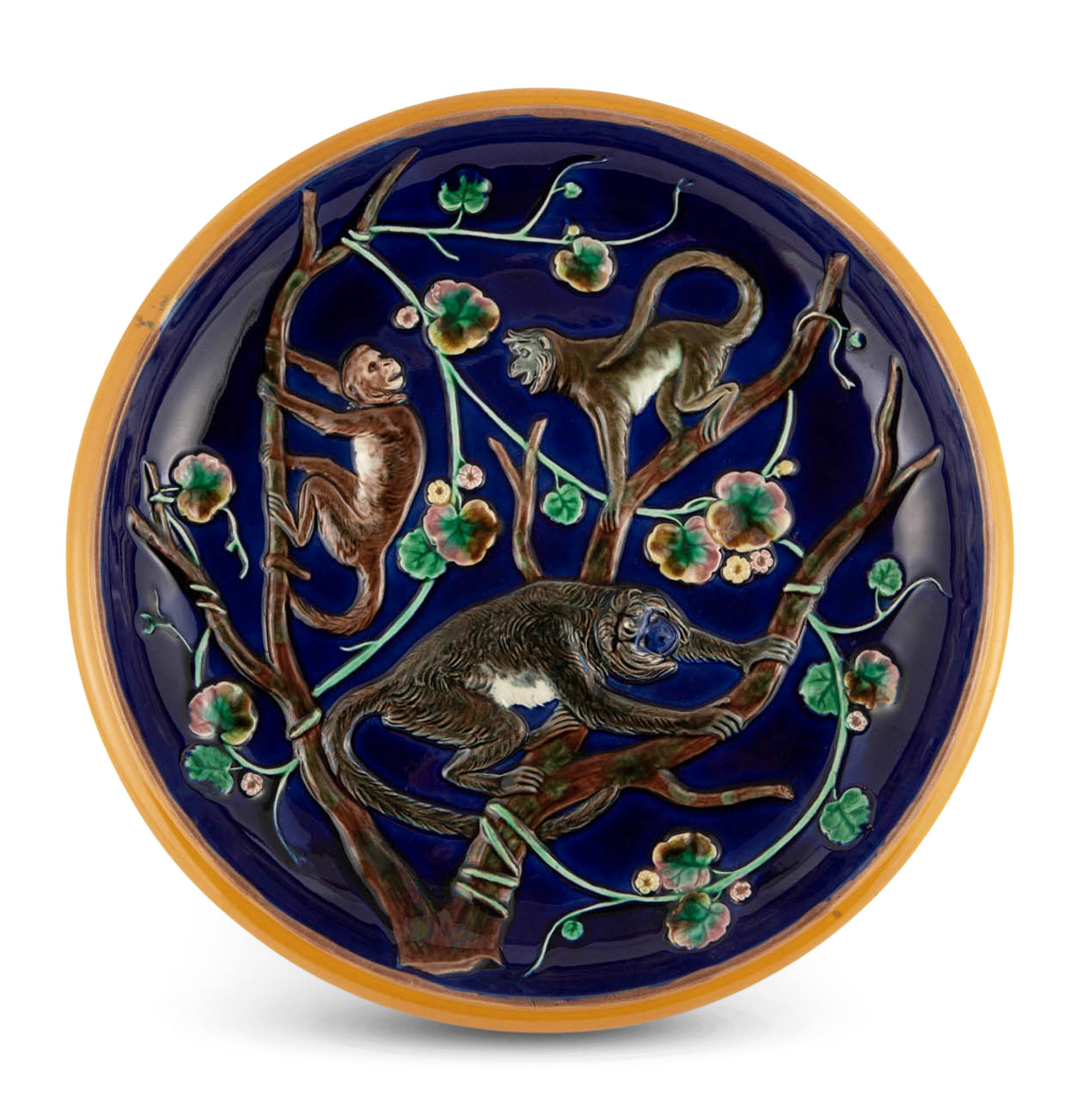 Lot image - Josiah Wedgwood & Sons Majolica Cobalt-Blue Ground Monkey Pattern Circular Bread Tray