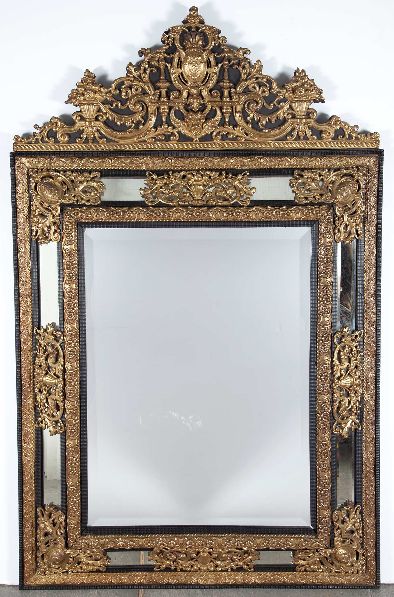Lot image - Baroque Style Gilt-Metal Mounted Ebonized Wood Mirror