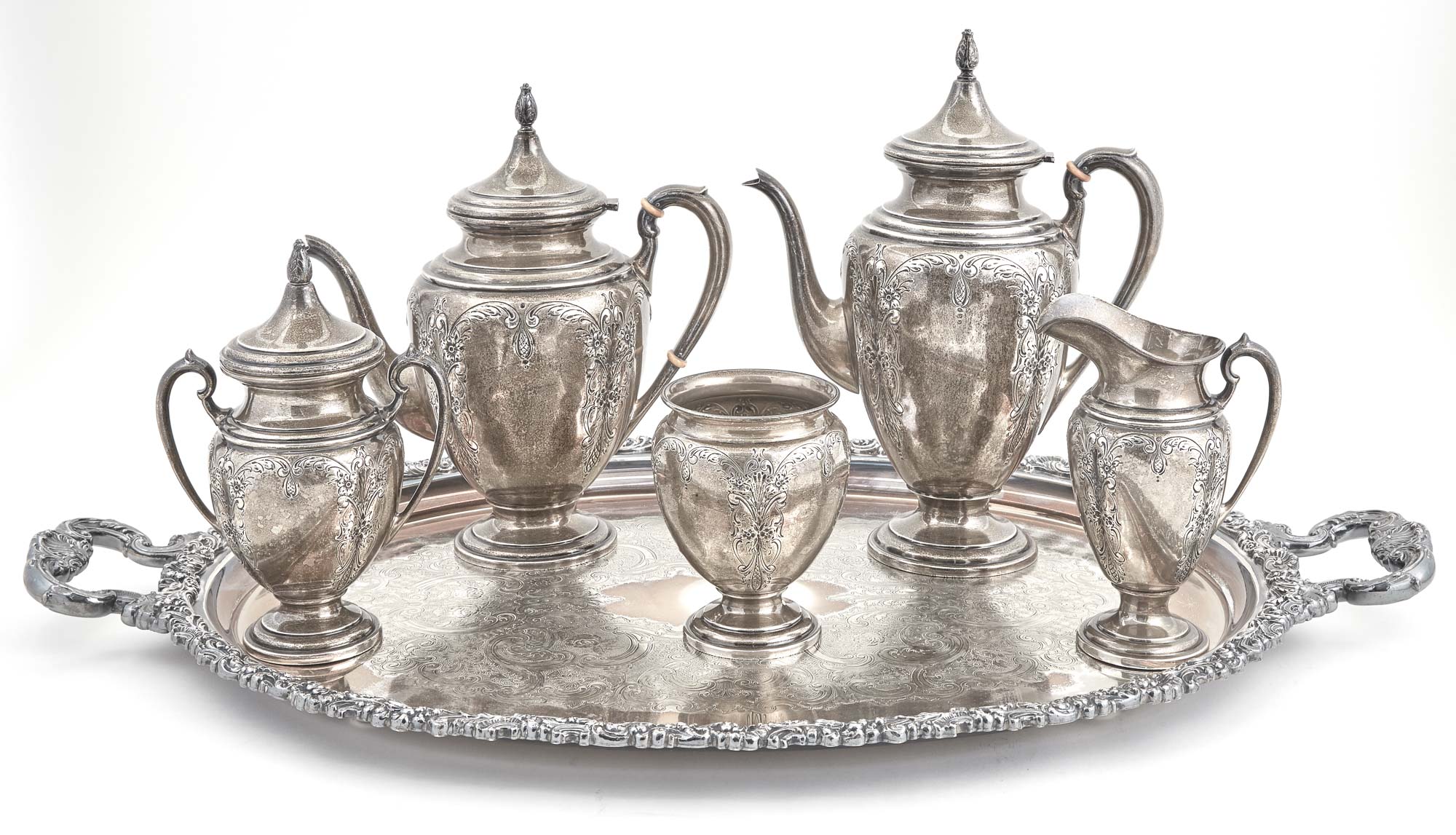 Lot image - Ellmore Sterling Silver Five-Piece Tea Service; Together with a Silver Plated Two-Handled Tray