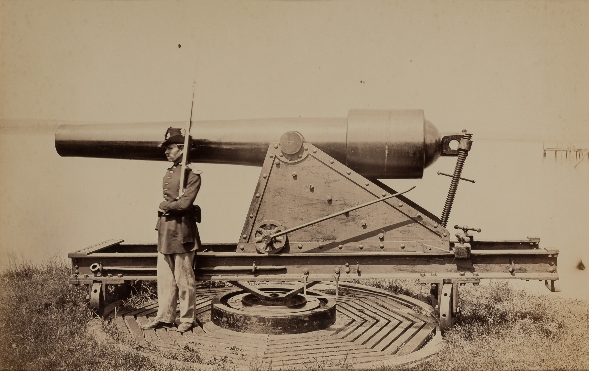 Lot image - BRADY, MATHEW [attrib.] (1823-1896)  [Soldier guarding artillery piece],