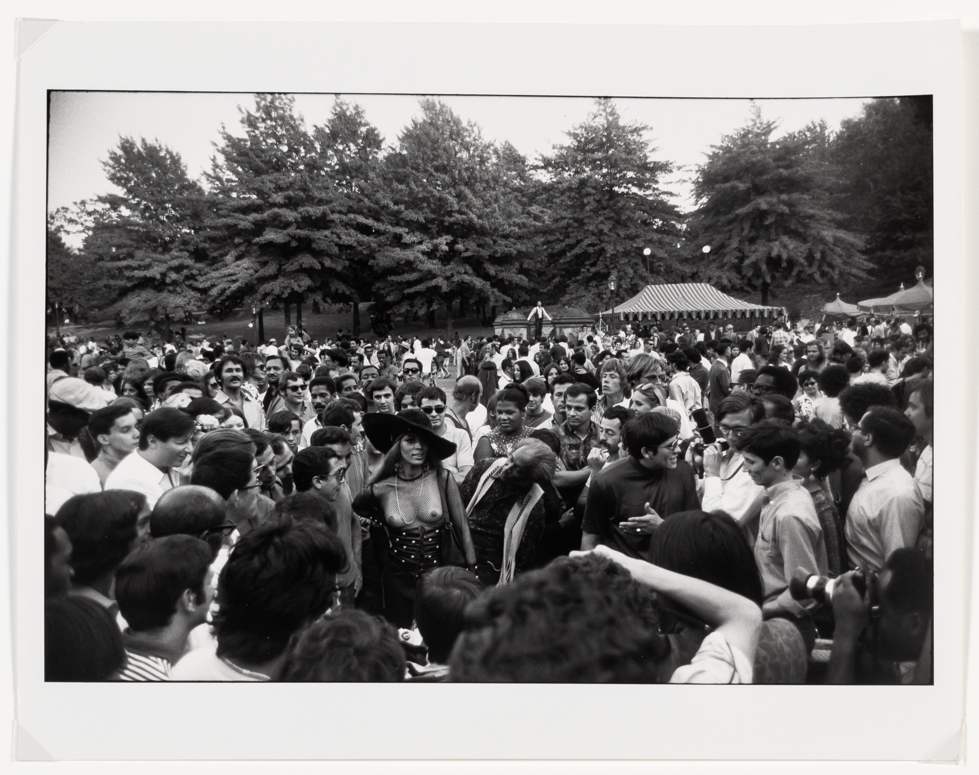 Lot image - WINOGRAND, GARRY (1928-1984)  Untitled [topless woman in crowd],