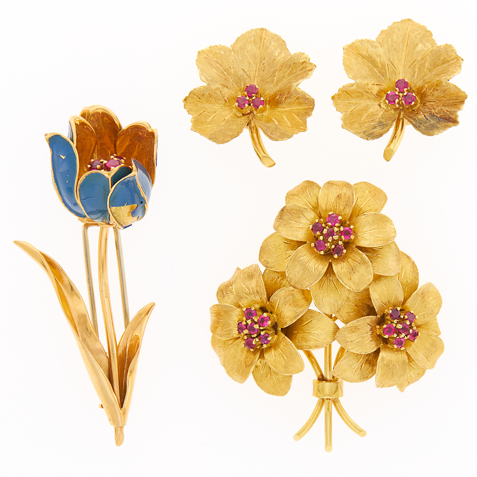 Lot image - Tiffany & Co. Gold and Ruby Bouquet Brooch and Pair of Leaf Earclips and Gold, Enamel and Ruby Tulip Brooch, France