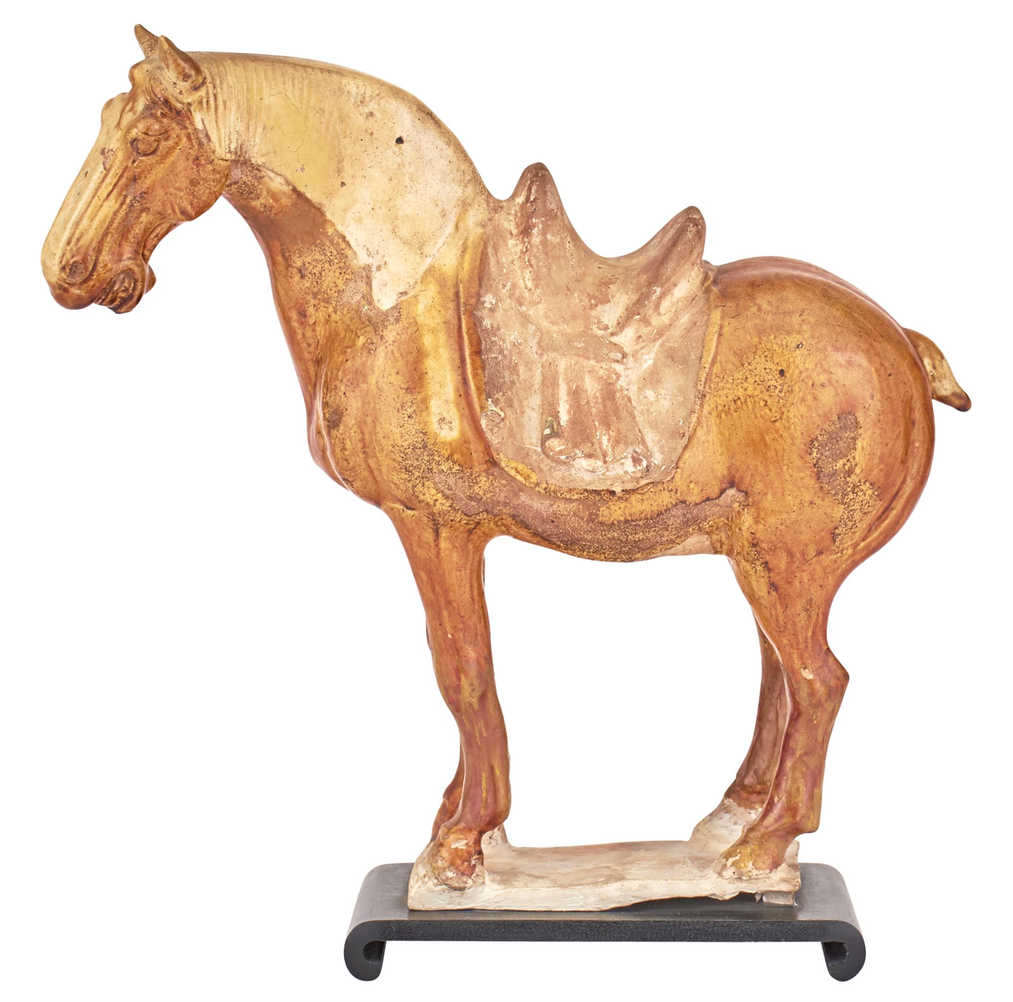 Lot image - A Chinese Ochre Glazed Pottery Horse