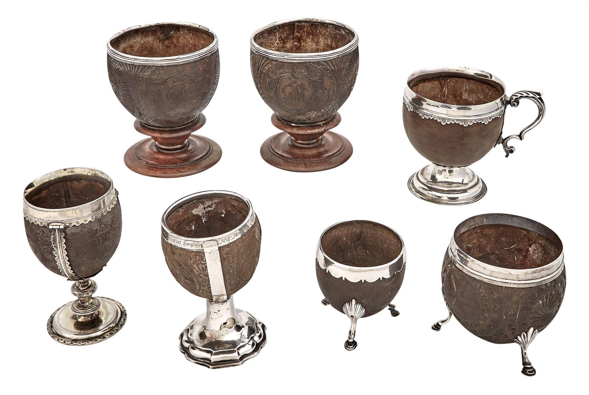 Lot image - Group of Seven Silver and Silver Plate Mounted Carved Coconut Cups