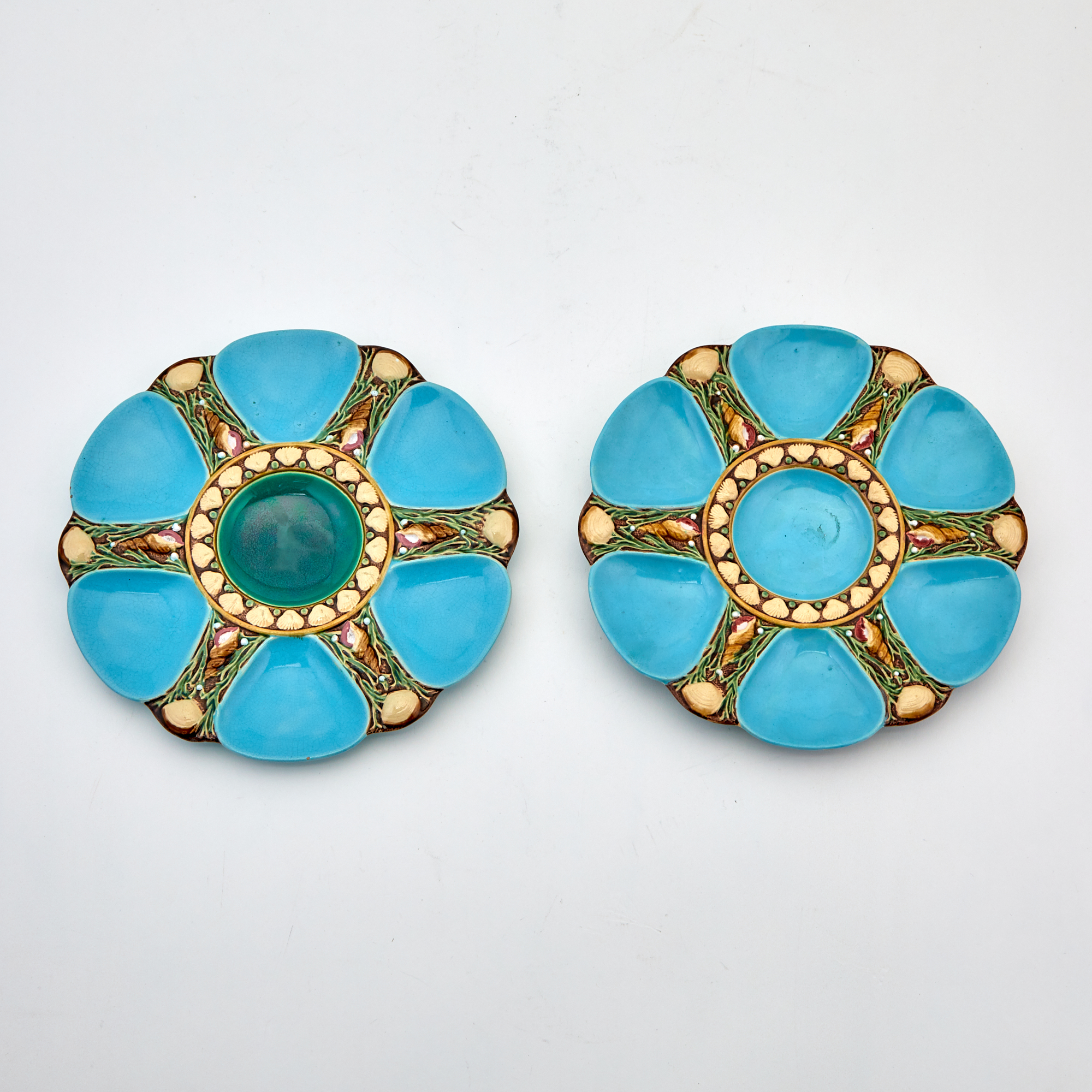 Lot image - Two Mintons Majolica Turquoise-Blue Ground Six-Pocket Oyster Plates