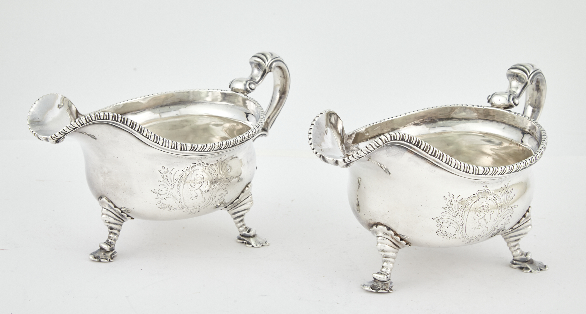 Lot image - Pair of George III Sterling Silver Sauceboats