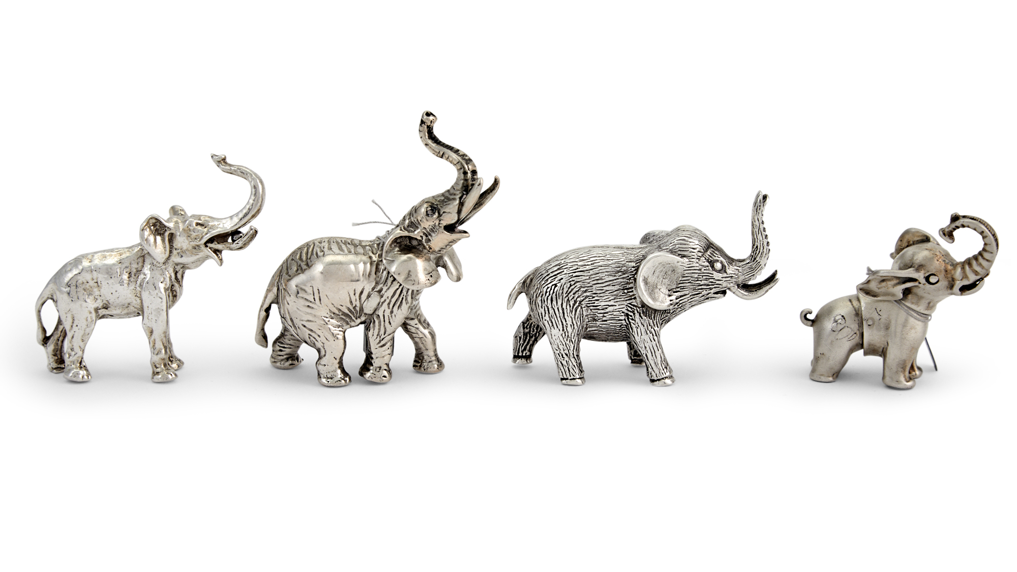 Lot image - Four Sterling Silver Miniature Figures of Elephants