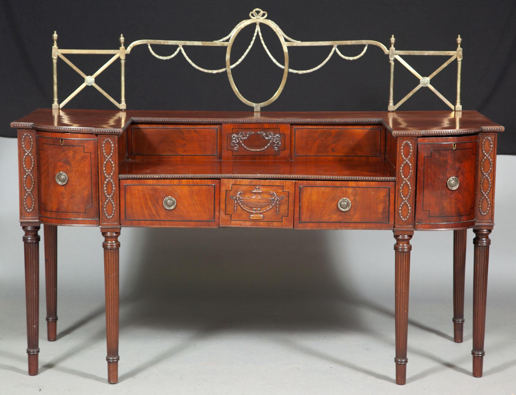 Lot image - Regency Style Ebony-Inlaid Mahogany and Brass-Mounted Sideboard