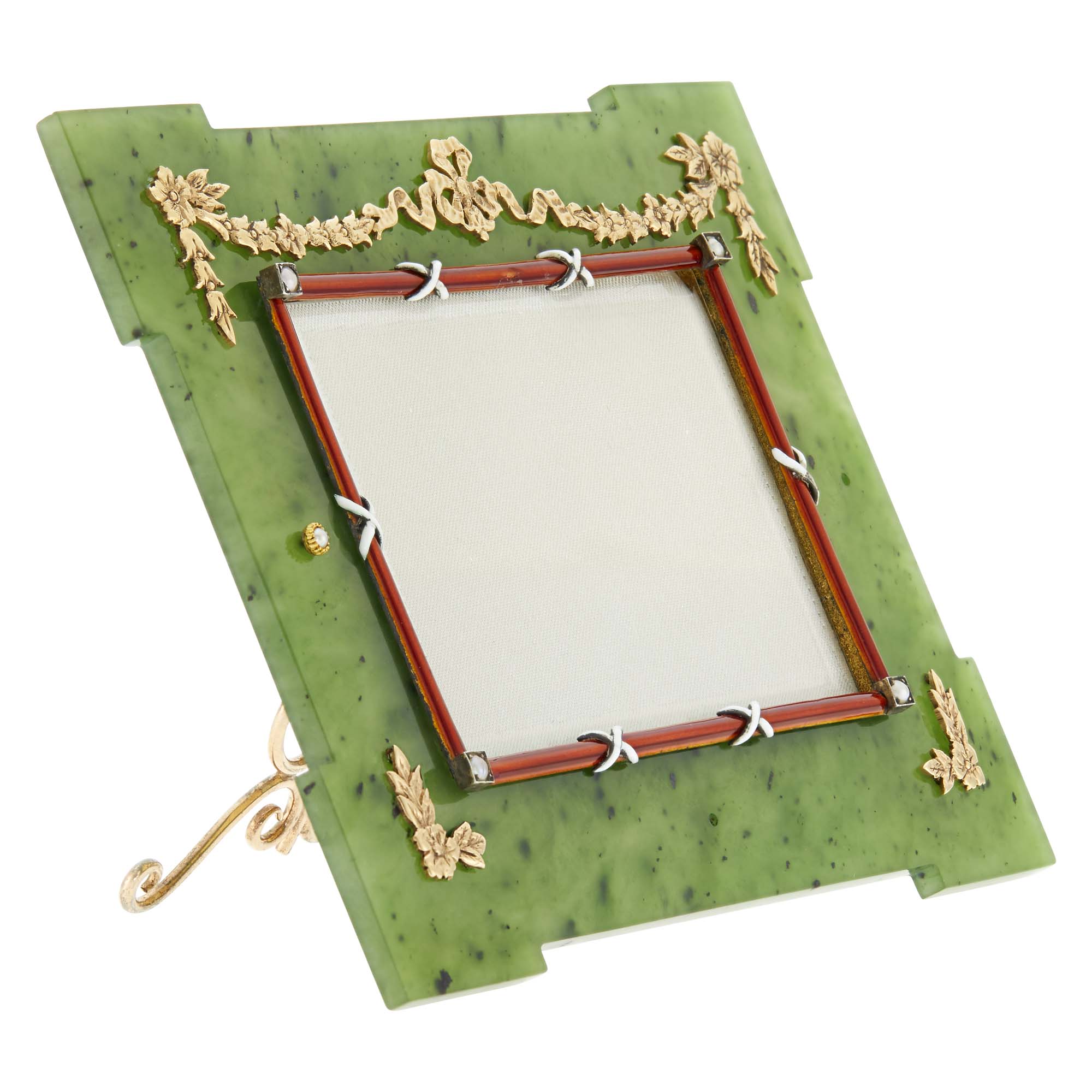 Lot image - Fabergé Enameled Gold and Silver-Gilt Mounted Nephrite Photograph Frame