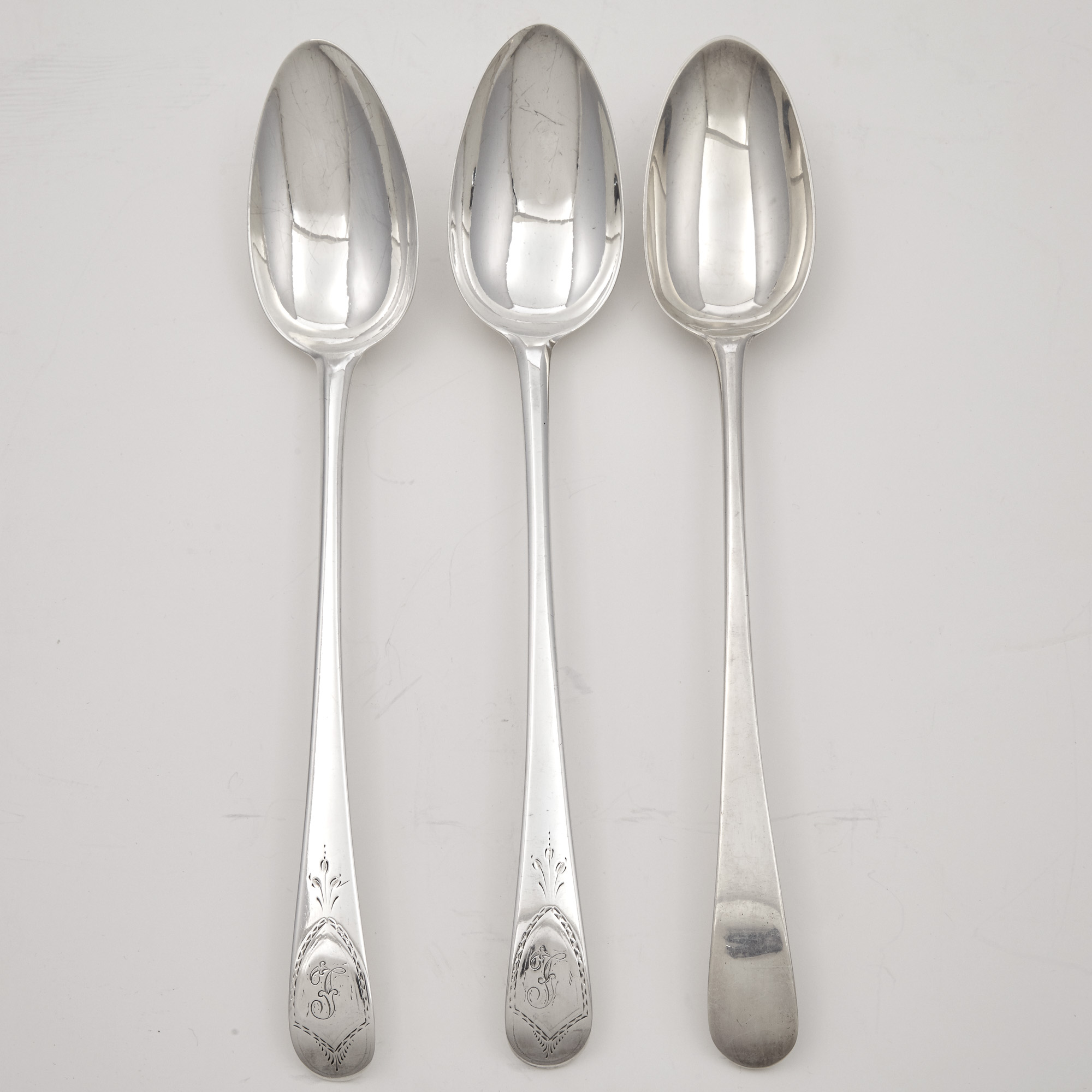 Lot image - Three George III Sterling Silver Stuffing Spoons