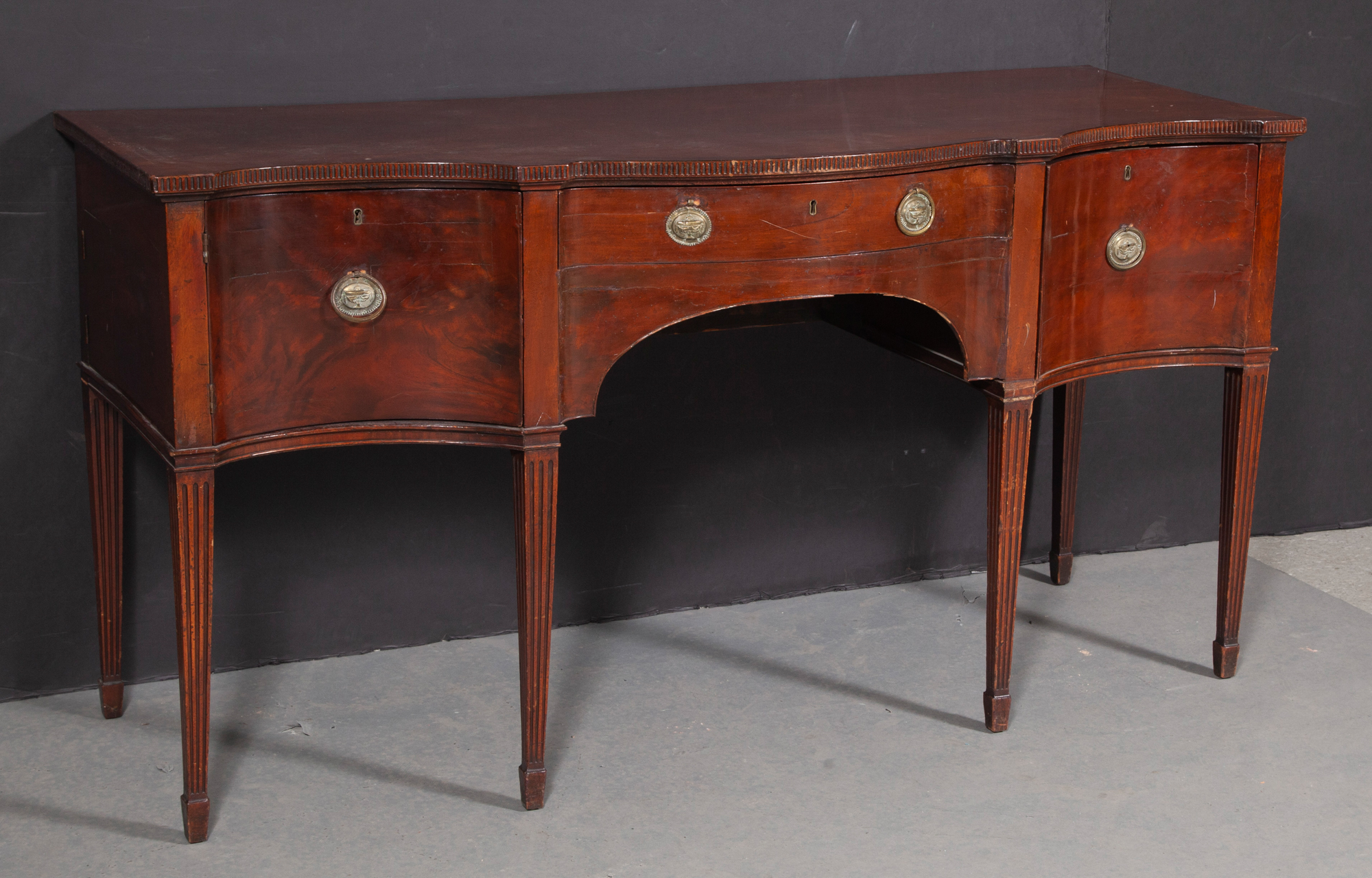 Lot image - George III Mahogany Serpentine Sideboard