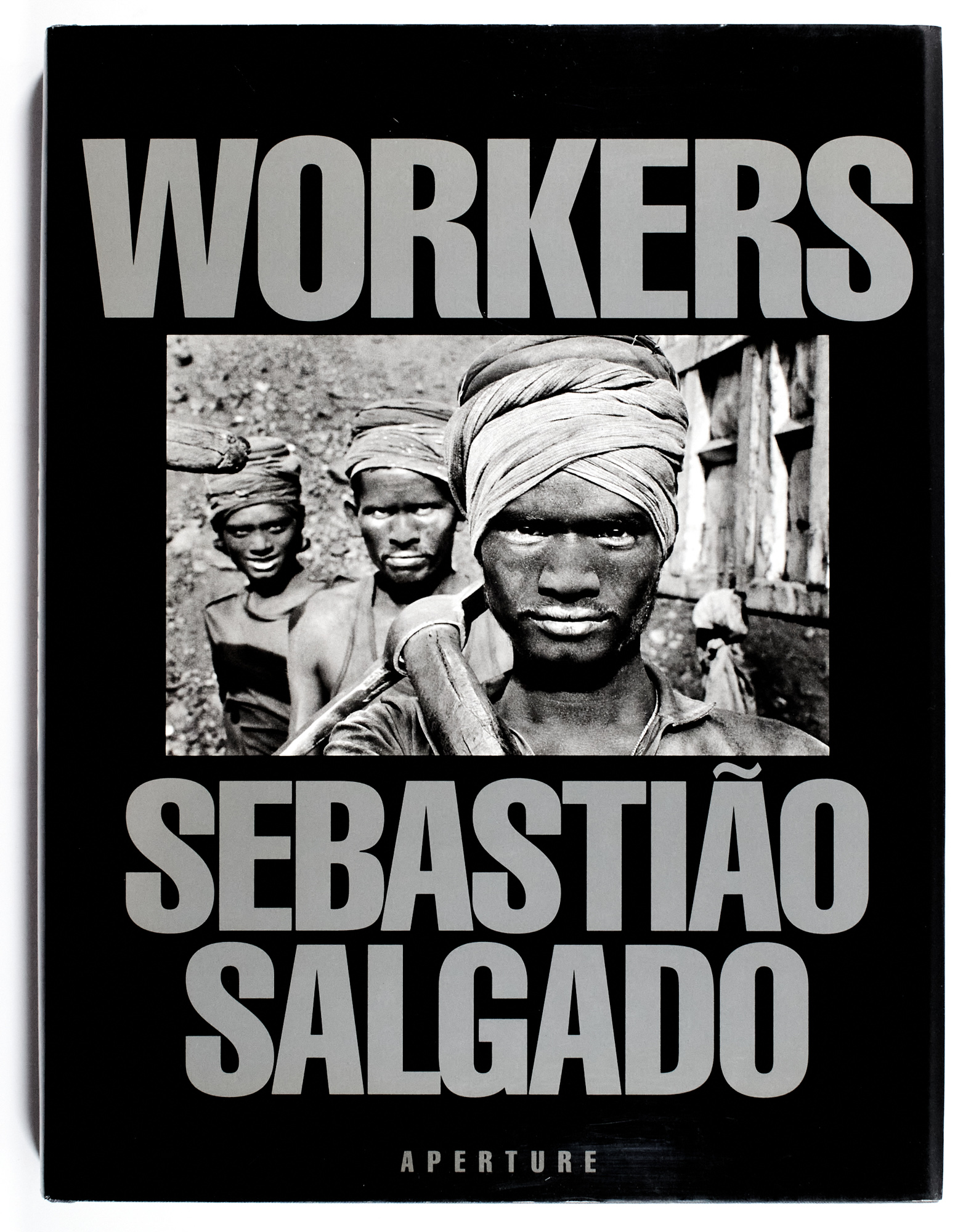 Lot image - [PHOTOBOOK]  SALGADO, SEBASTIÃO. Two inscribed works by the great social documentarian and photojournalist.