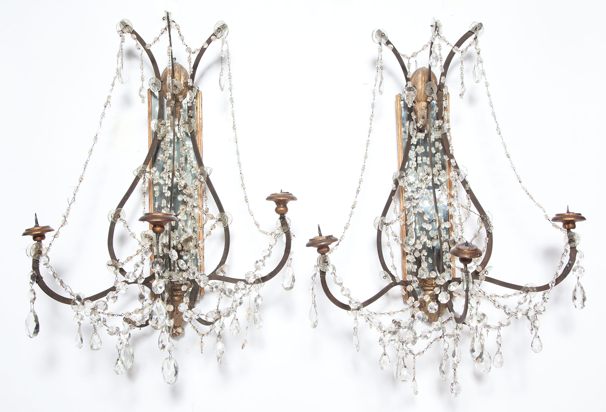 Lot image - Pair of Continental Giltwood, Wrought Metal and Glass Mirror-Back Sconces