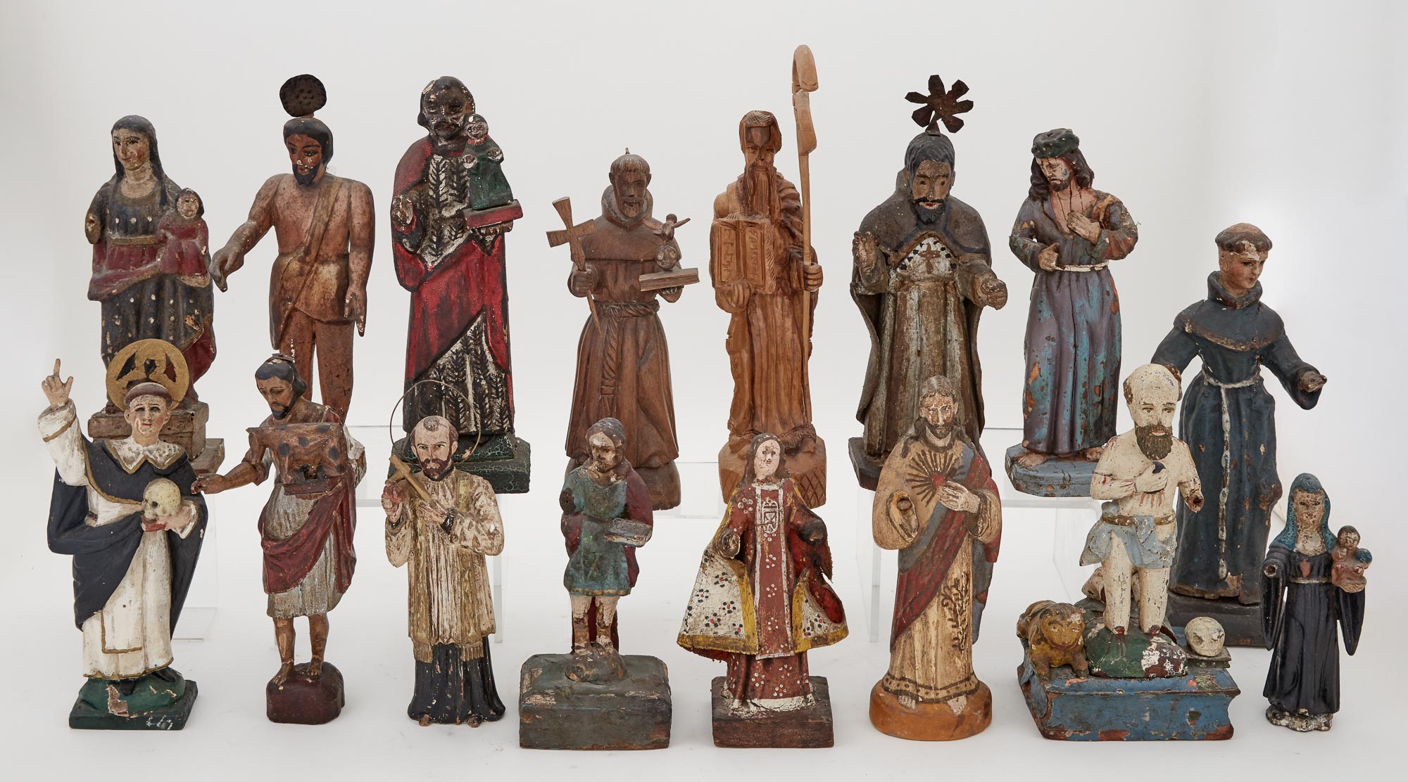 Lot image - Miscellaneous Group of Sixteen Painted and Carved Wood Santos Figures