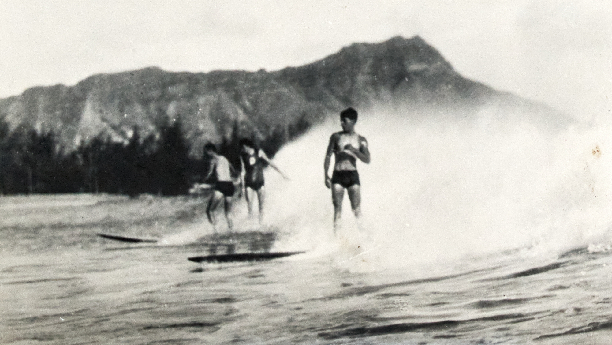 Lot image - [HAWAII-HULA & SURFING]  An oblong souvenir photograph album with leather covers printed in color, circa