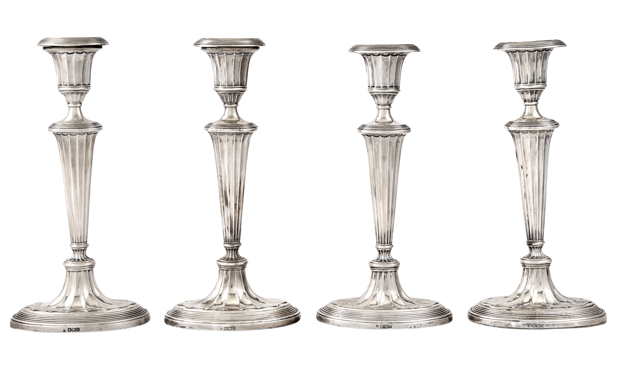 Lot image - Set of Four Edward VII Neoclassical Style Sterling Silver Candlesticks