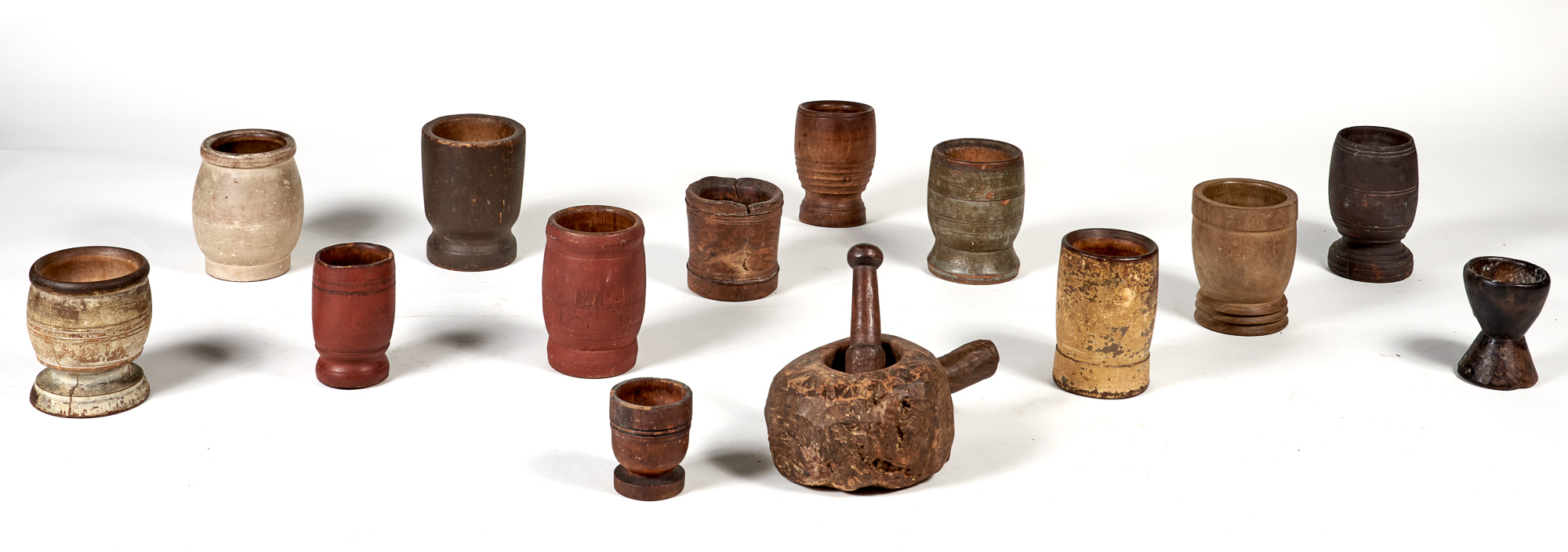 Lot image - Group of Thirteen Carved and Turned Wood Mortars
