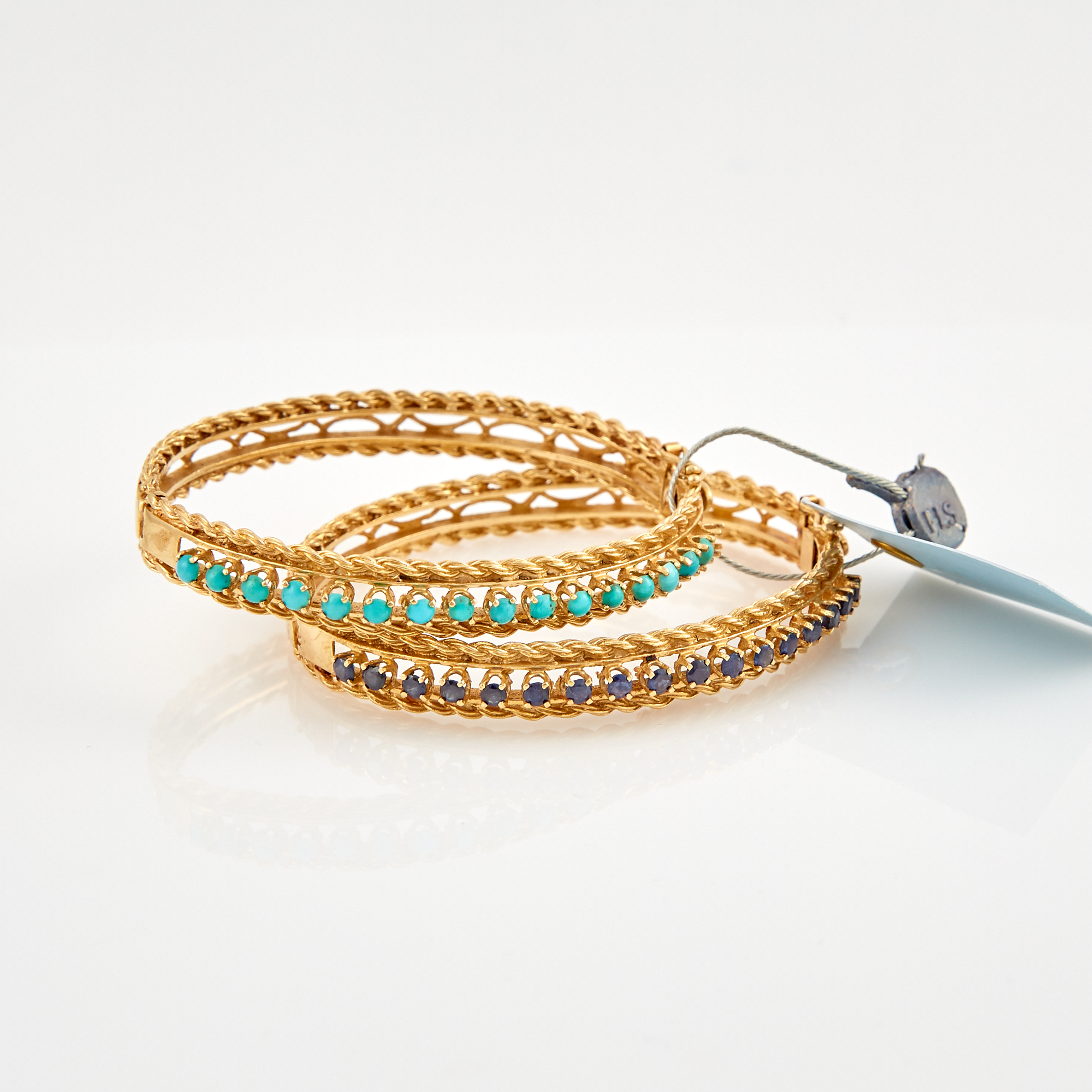 Lot image - Two Gold and Stone Rigid Bracelets, 14K 21 dwt. all, stone missing