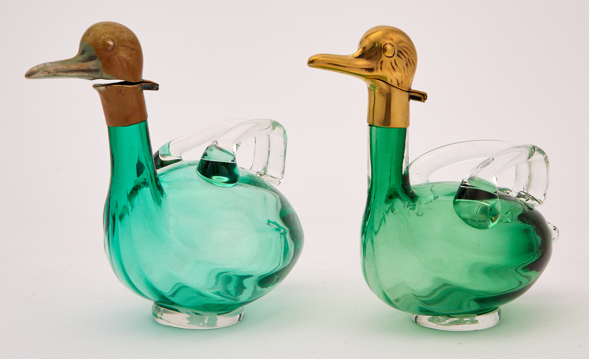 Lot image - Pair of Continental Novelty Brass and Green Glass Bird Form Decanters
