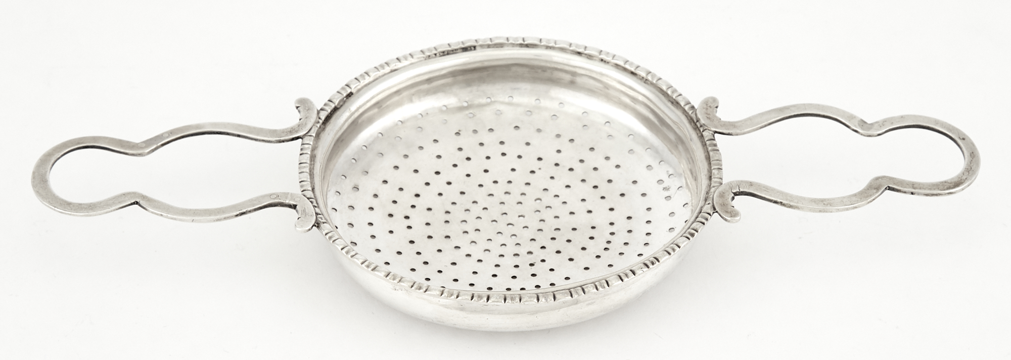 Lot image - Georgian Sterling Silver Punch Strainer