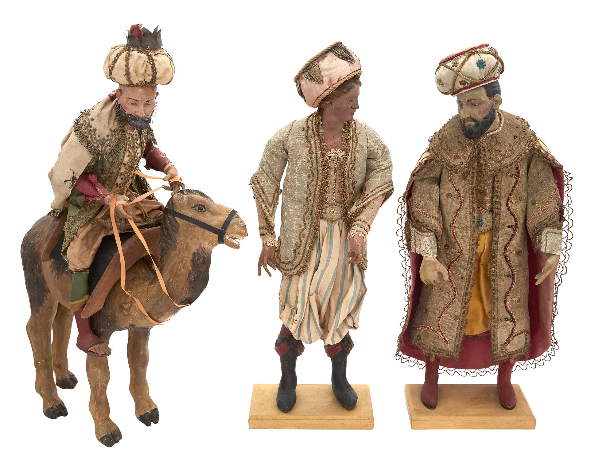 Lot image - Group of Three Neapolitan Composition, Carved Wood and Textile Crèche Figures of the Magi