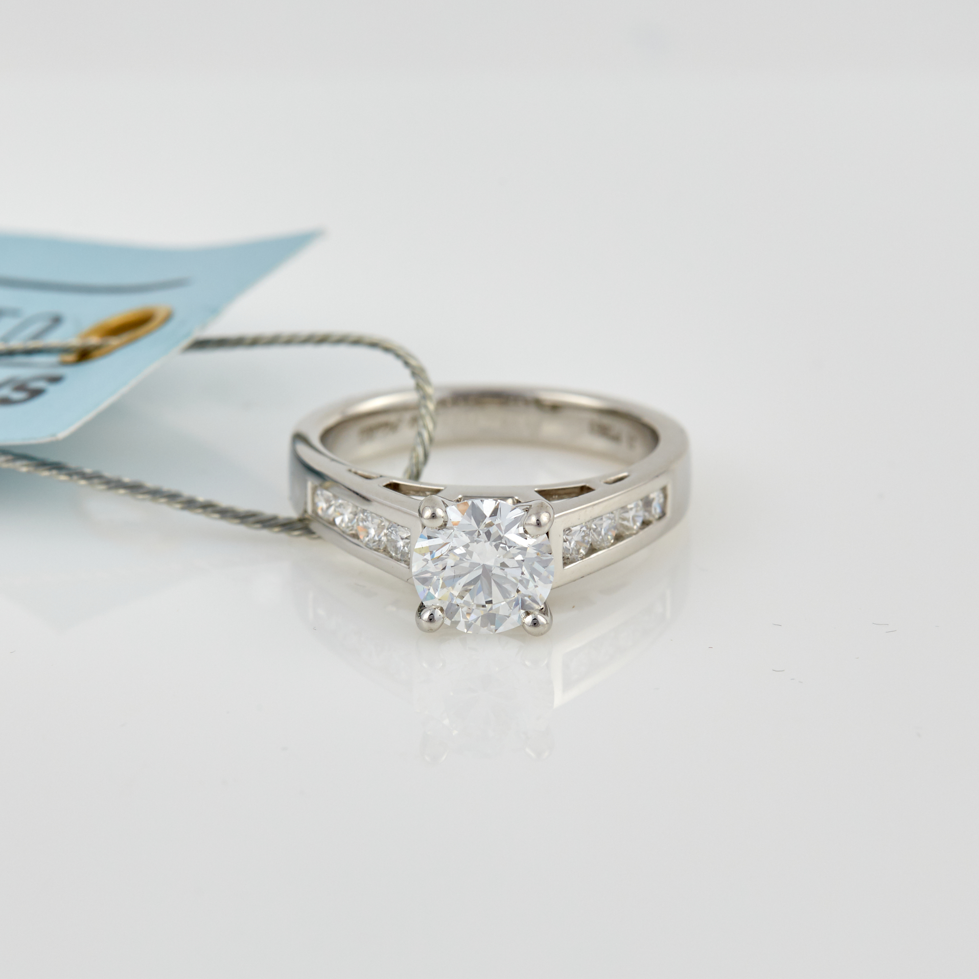 Lot image - Diamond Engagement Ring, 9 diamonds, center stone about 1.40 cts., 8 stones about 0.40 ct., Platinum6 dwt.