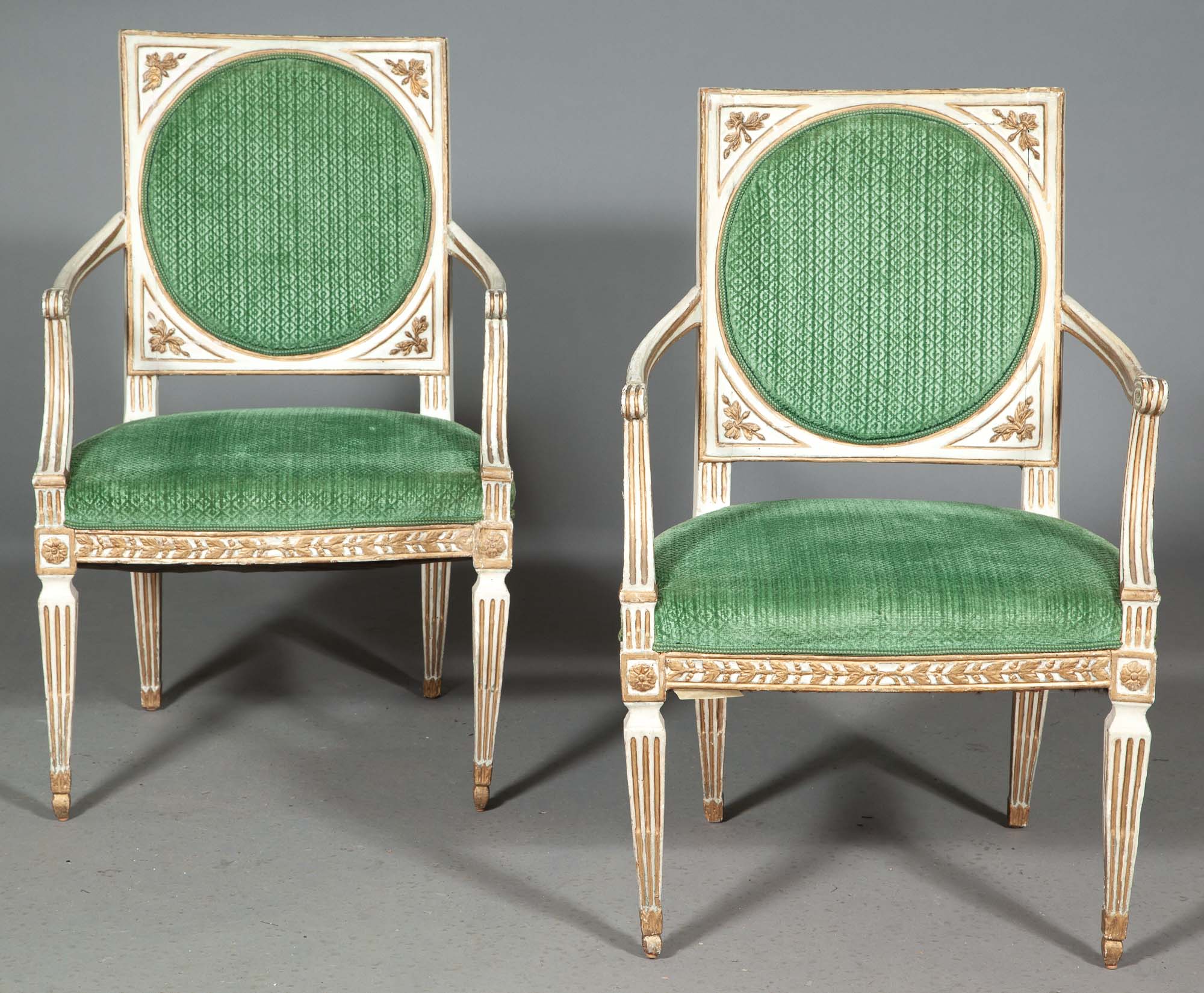 Lot image - Pair of Italian Neoclassical Painted and Parcel-Gilt Armchairs
