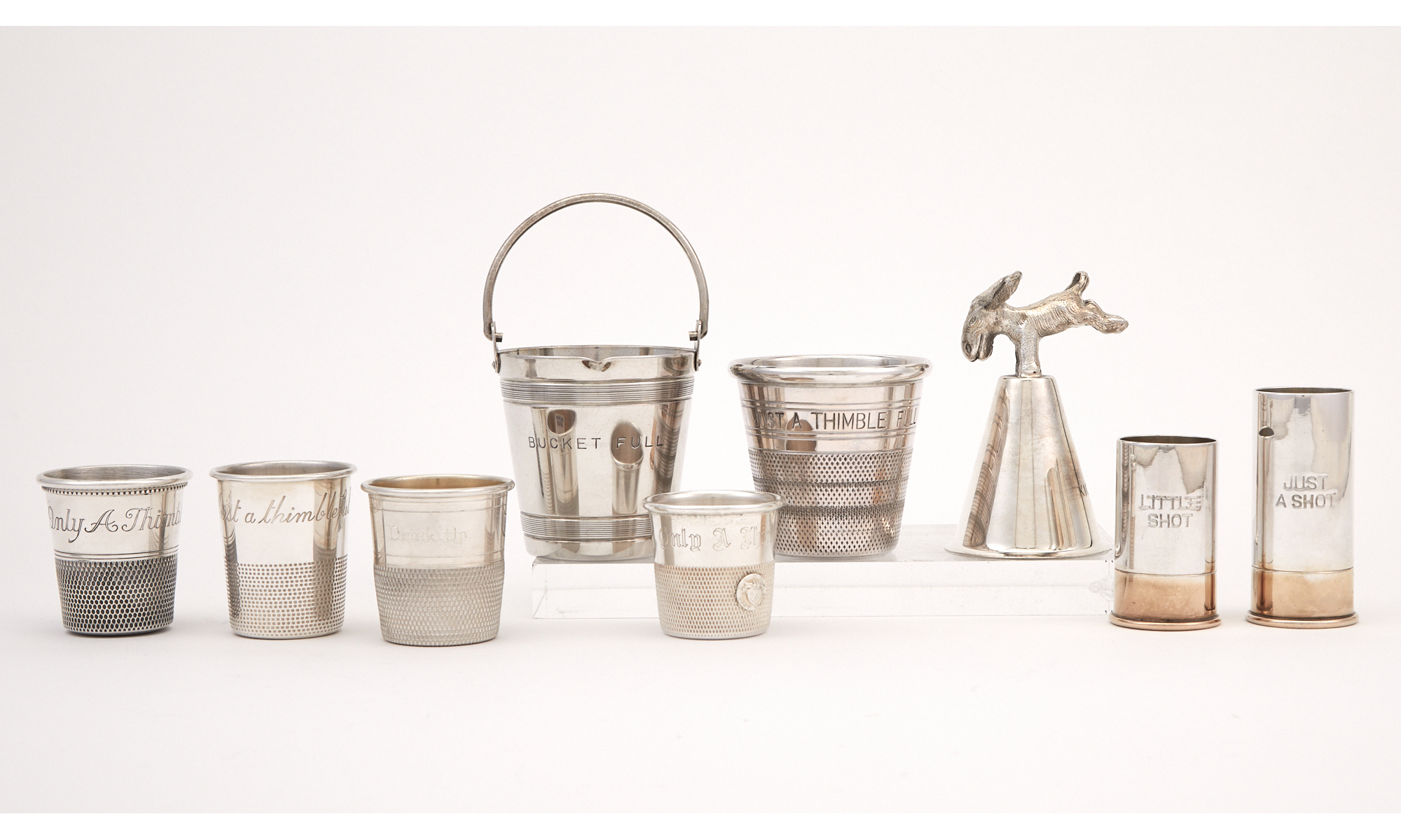 Lot image - Group of Sterling Silver and Silver-Plated Novelty Spirit Measures