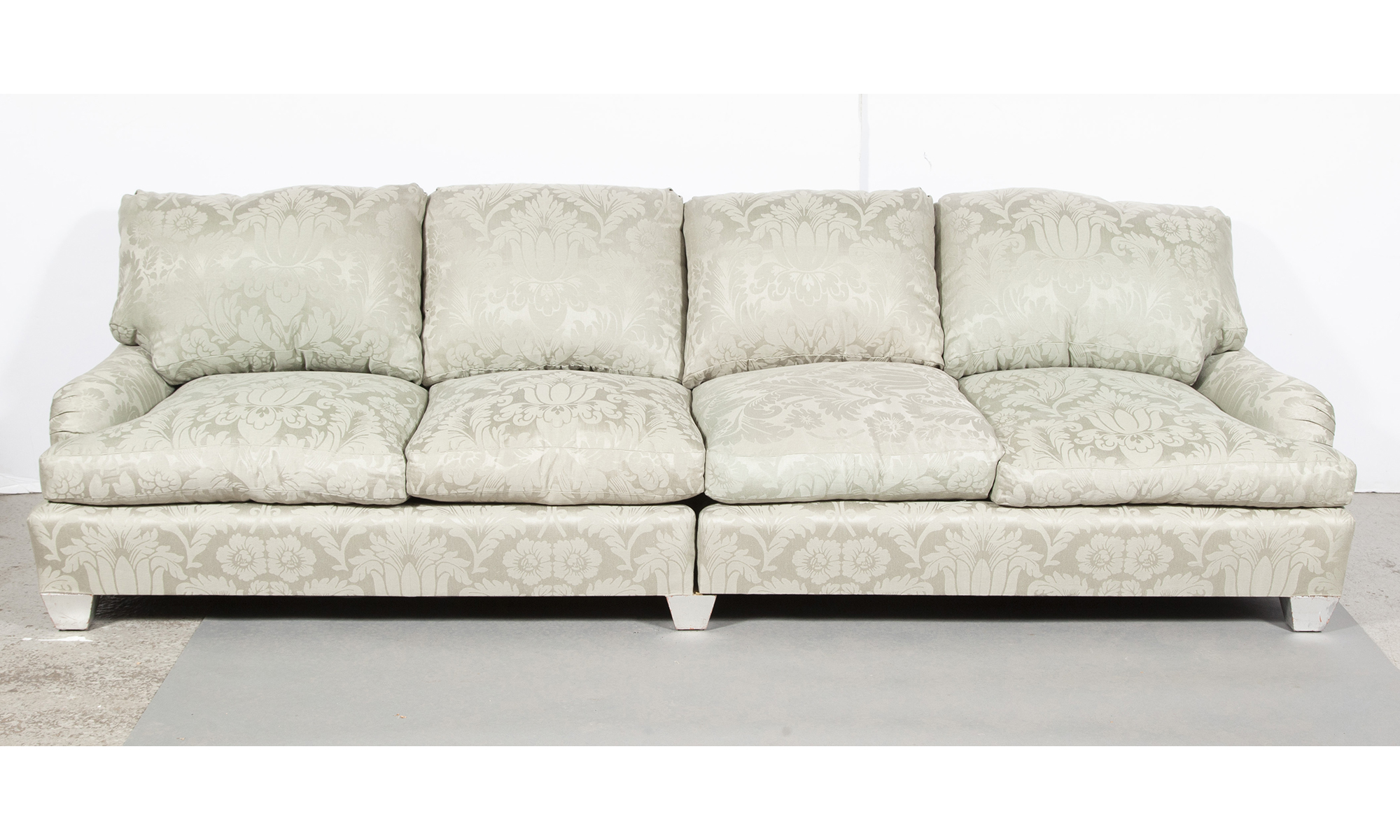 Lot image - Upholstered Four-Cushion Sofa