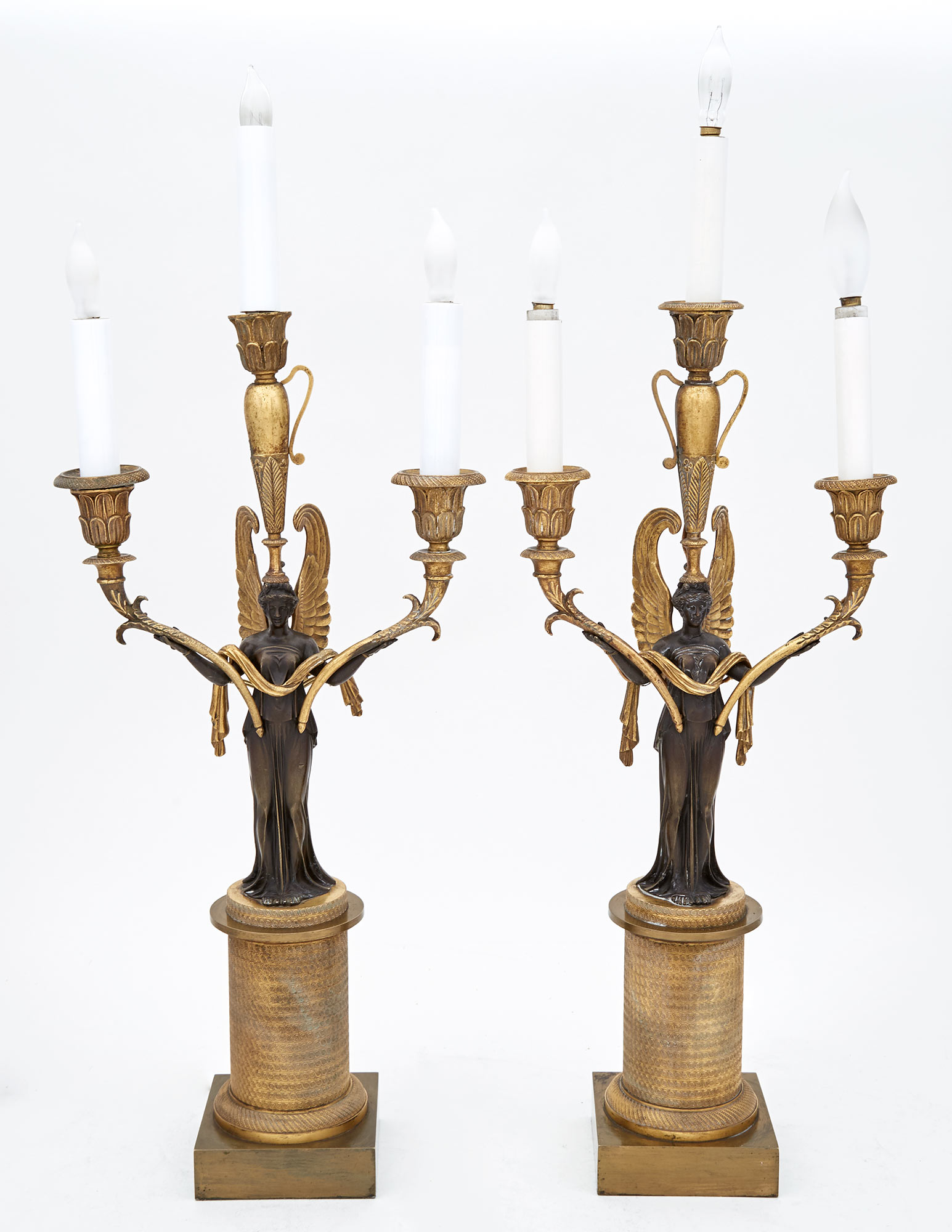 Lot image - Pair of Restauration Patinated and Gilt-Bronze Three-Light Candelabra