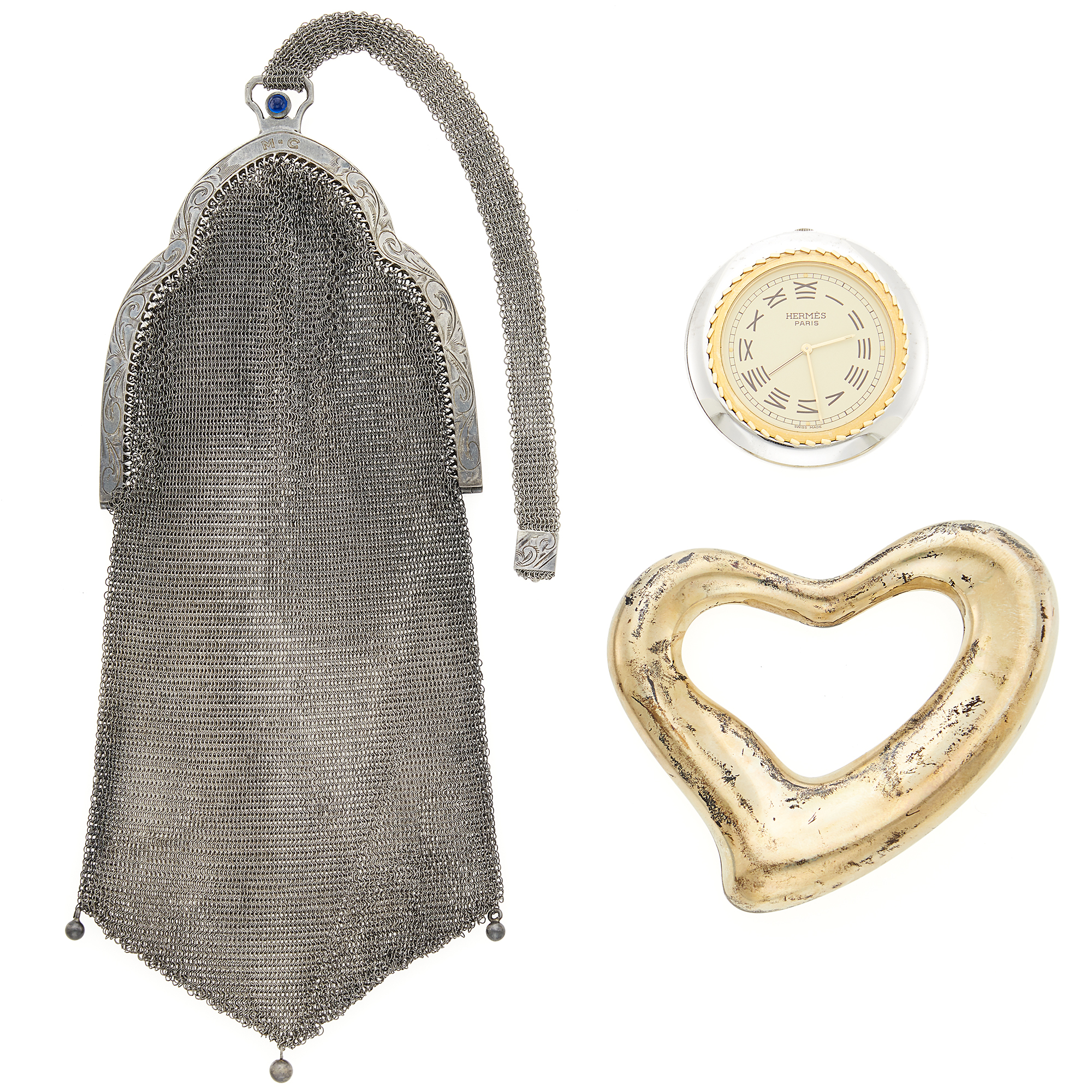 Lot image - Tiffany & Co., Elsa Peretti Sterling Silver Belt Buckle, Hermès Travel Clock and Antique Silver Mesh Purse
