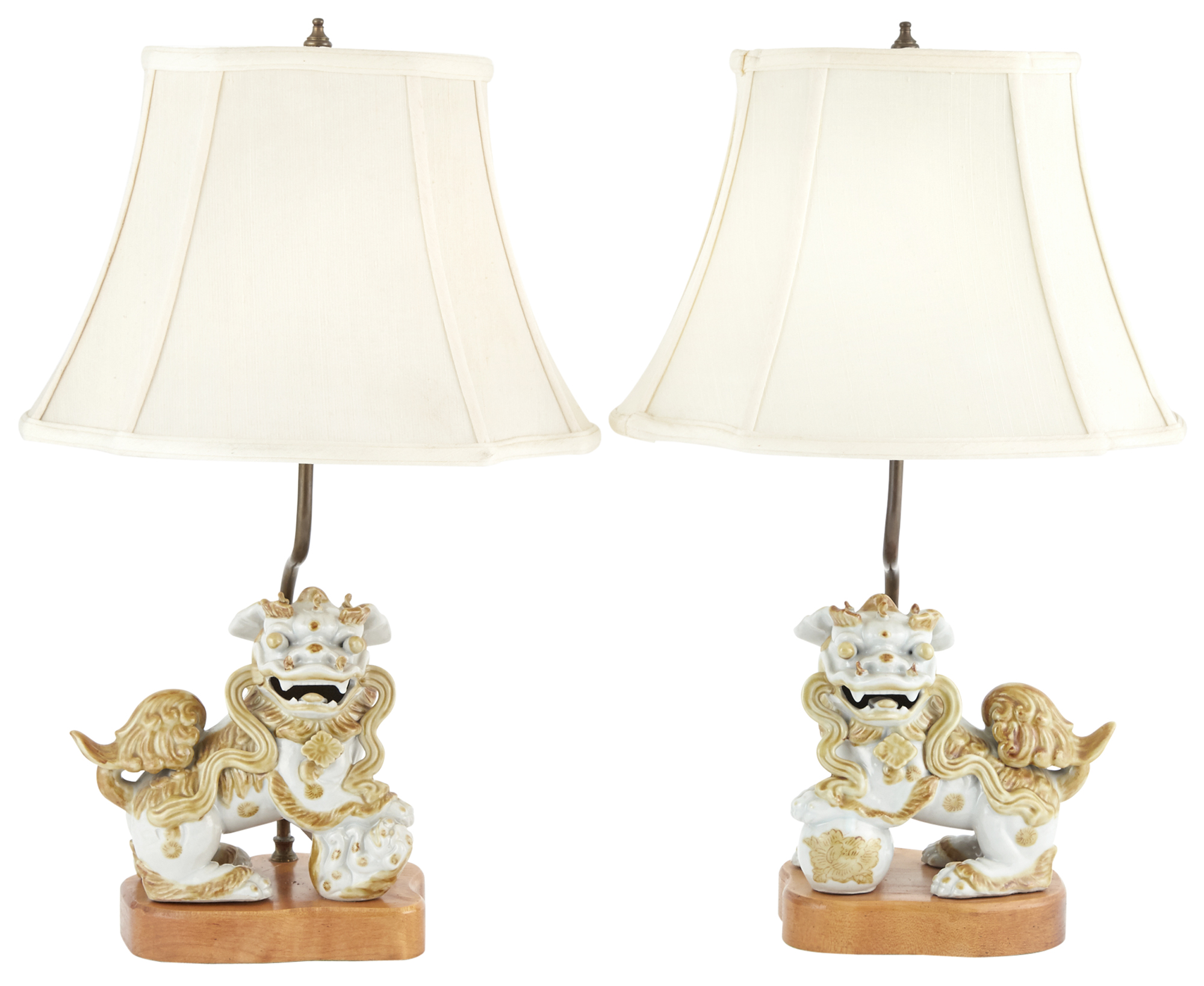 Lot image - Pair of Ochre Decorated White Ceramic Fu Dogs