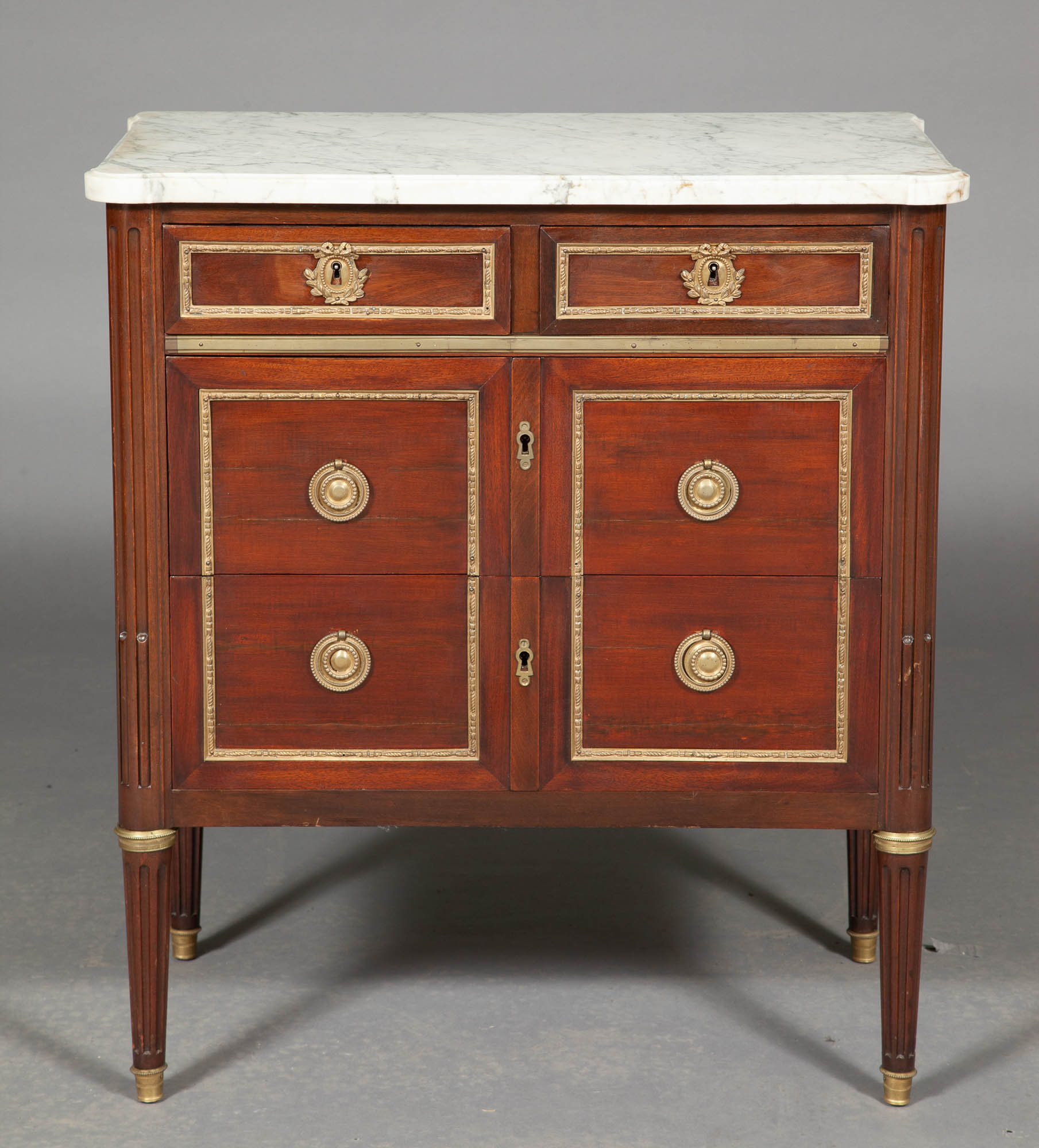 Lot image - Pair of Louis XVI Style Mahogany and Gilt-Metal Mounted Marble Top Small Commodes