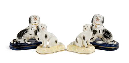 Lot image - Pair of English Porcelain Seated Spaniels; Together with a Pair of English Pottery Black and White Spaniels