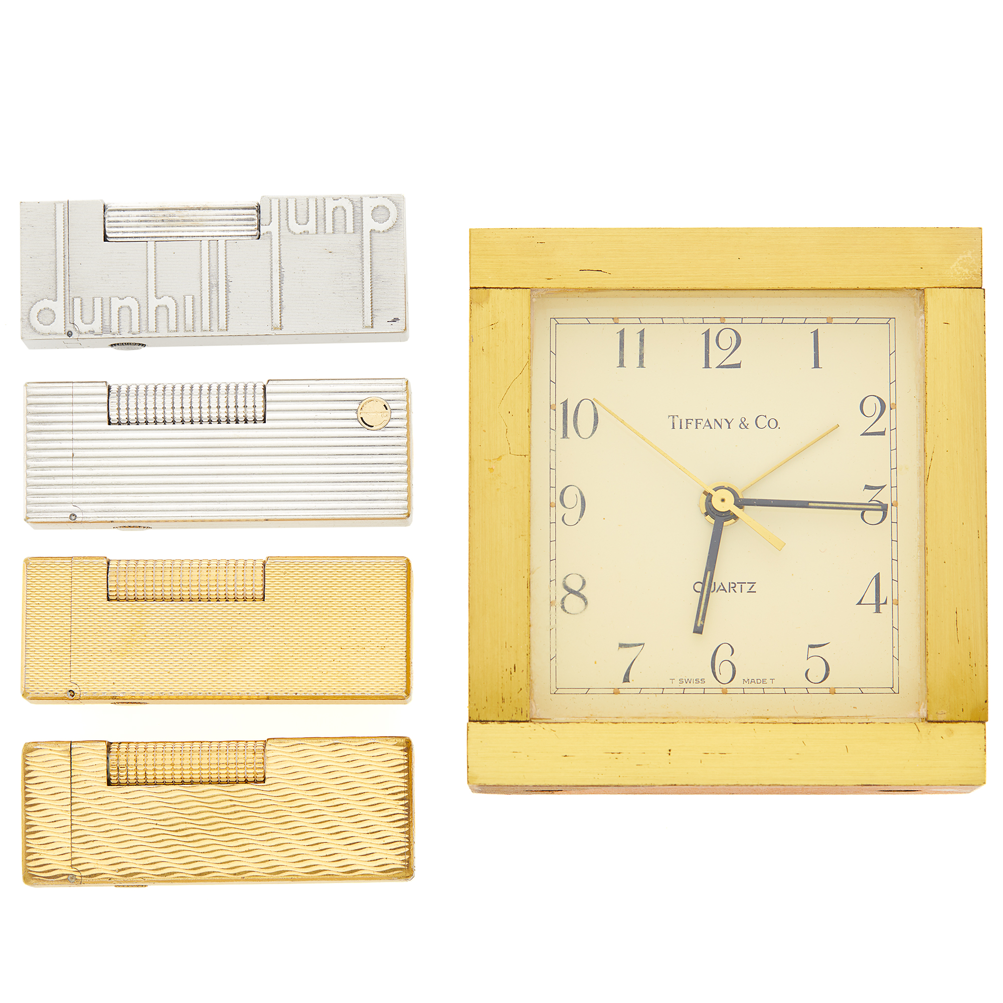 Lot image - Tiffany & Co. Travel Clock and Four Dunhill Lighters