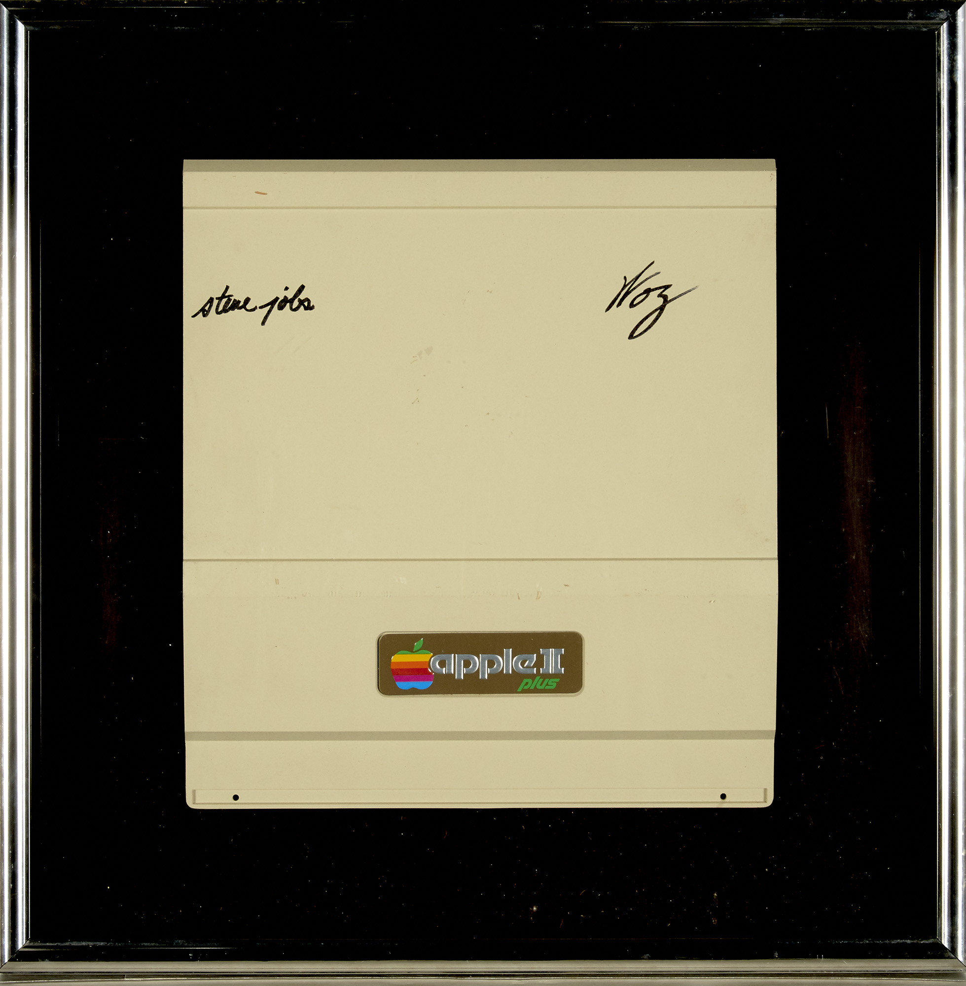 Lot image - [JOBS, STEVE and STEVE WOZNIAK]  Signed lid from an Apple II Plus computer, signed by Steve Jobs and Steve Wozniak (signing as Woz).