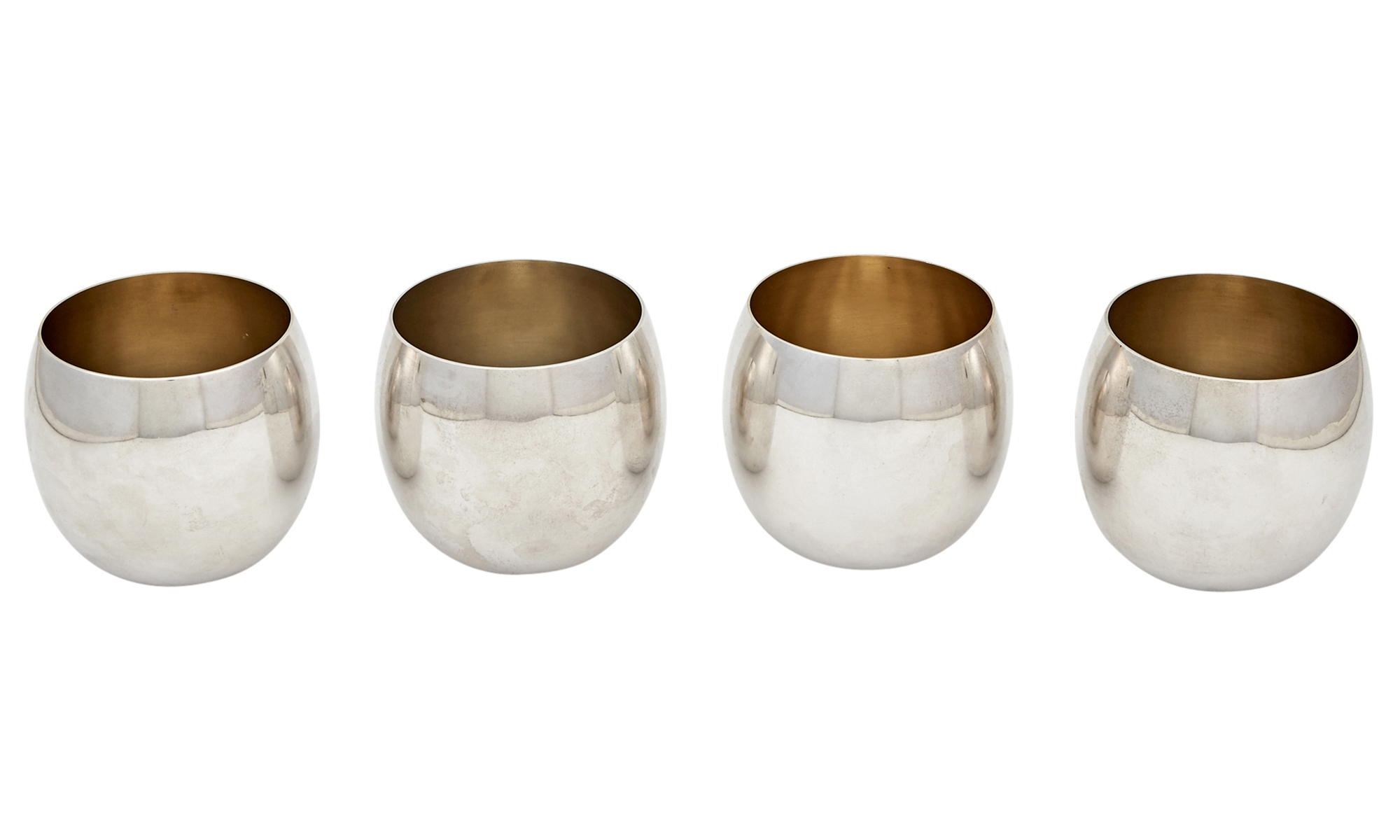 Lot image - Set of Four Tiffany & Co. Sterling Silver and Parcel-Gilt Tumblers