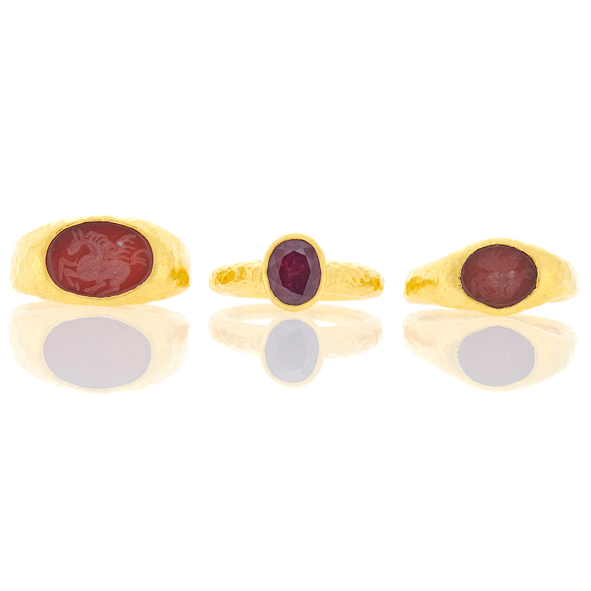 Lot image - Three High Karat Gold, Carnelian Intaglio and Ruby Rings