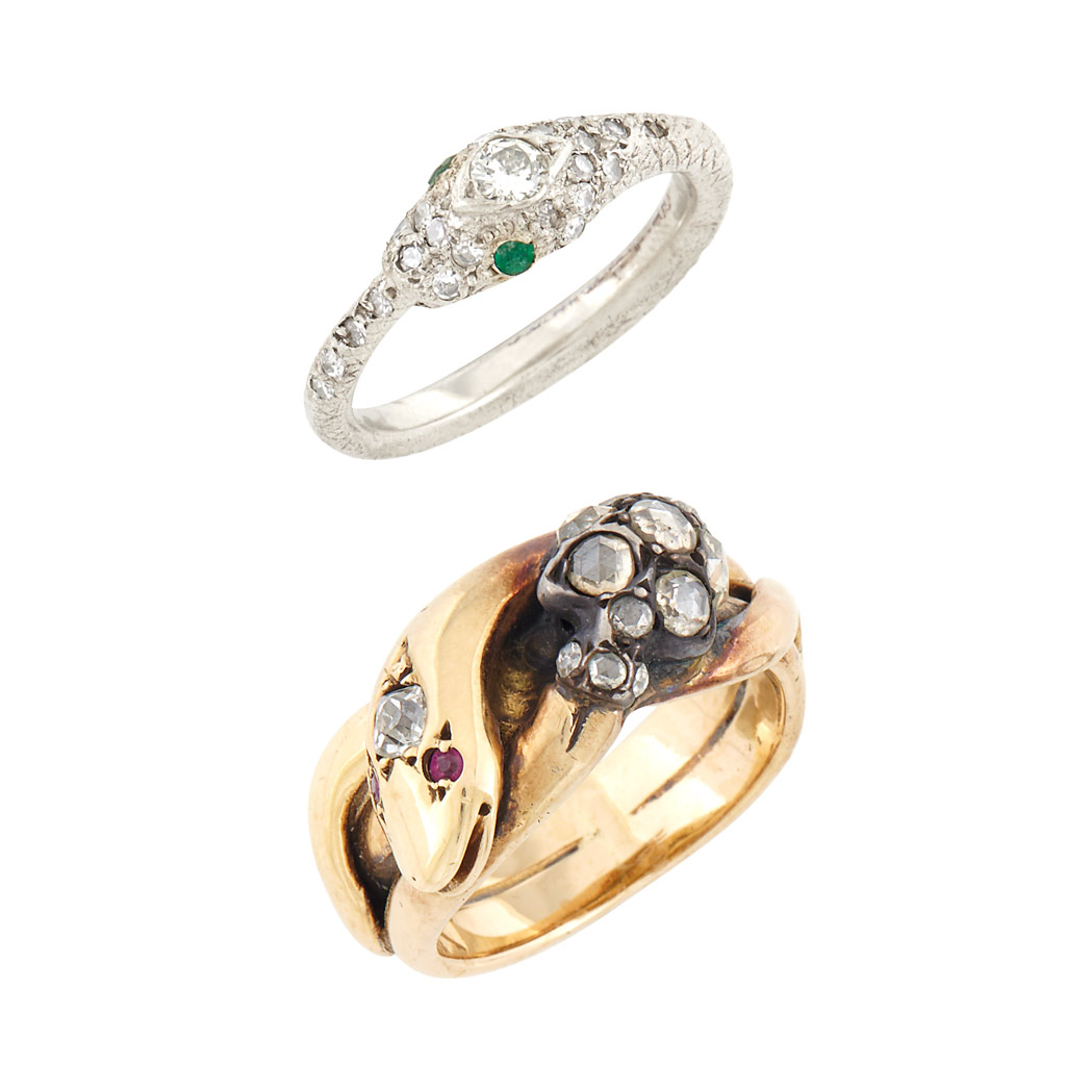 Lot image - Antique Low Karat Gold, Silver, Diamond and Ruby Snake and Skull Ring and White Gold, Diamond and Emerald Snake Ring