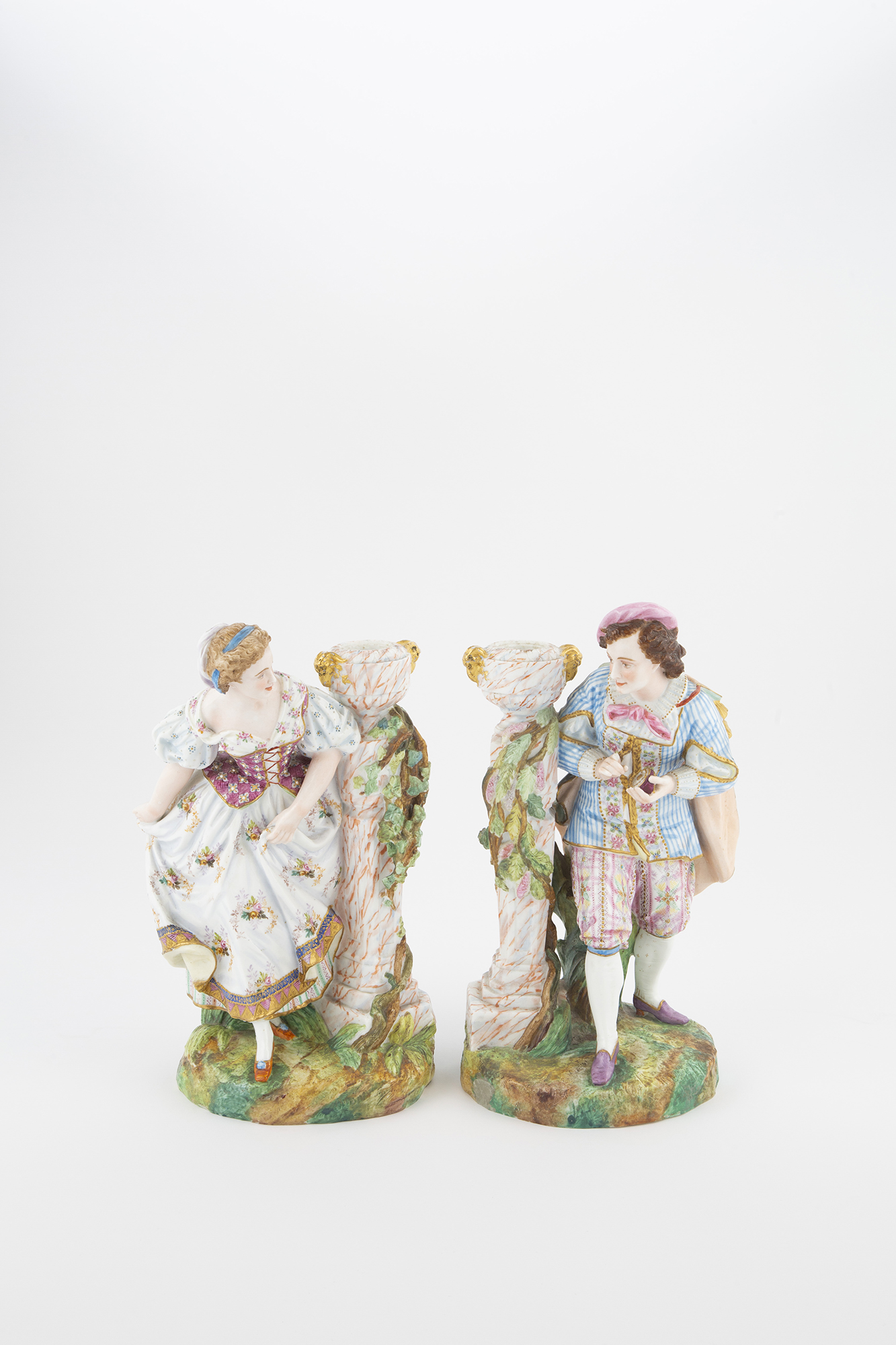Lot image - Pair of Bisque Figural Candlesticks