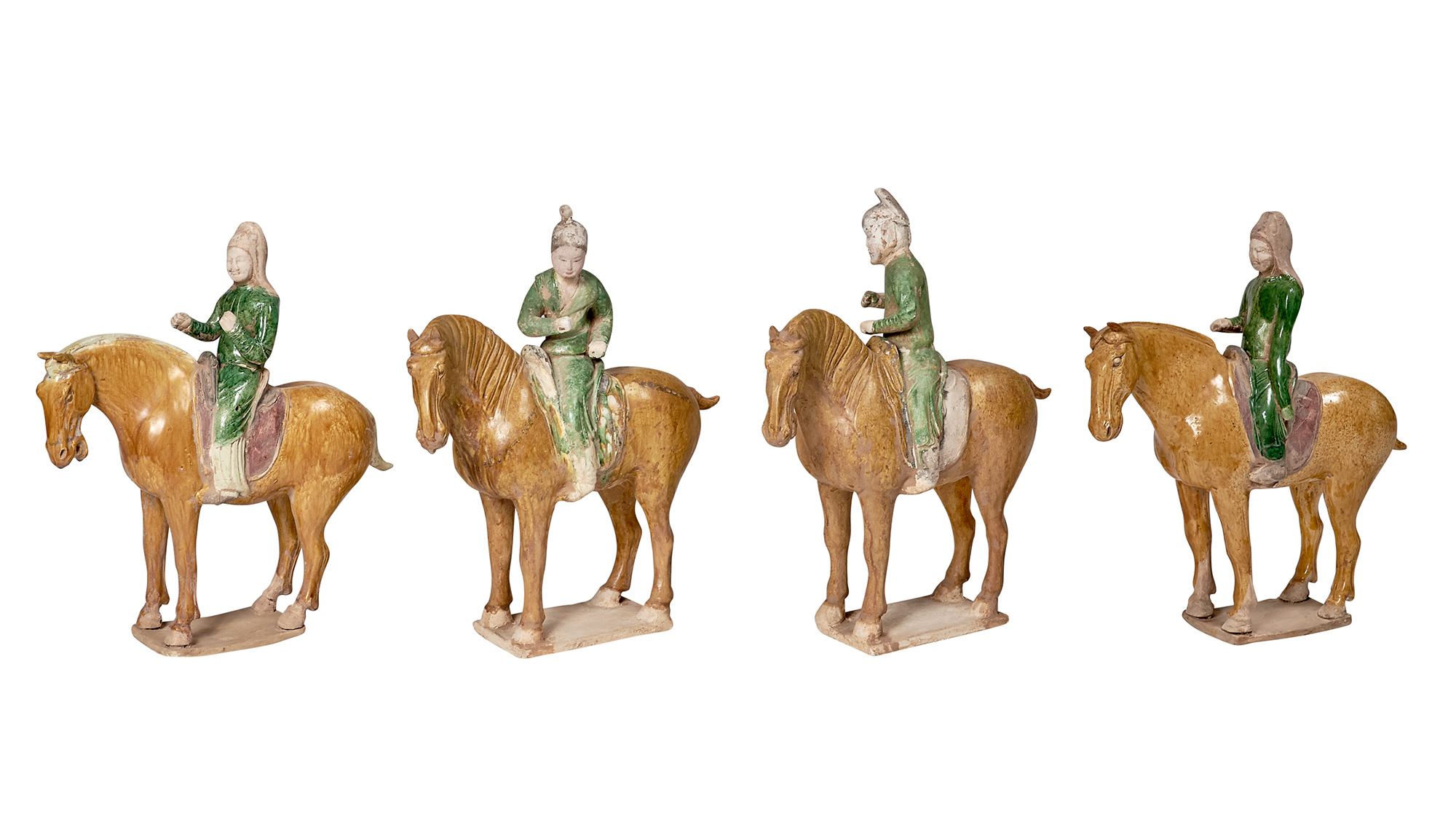 Lot image - Group of Four Chinese Glazed Pottery Mounted Horses