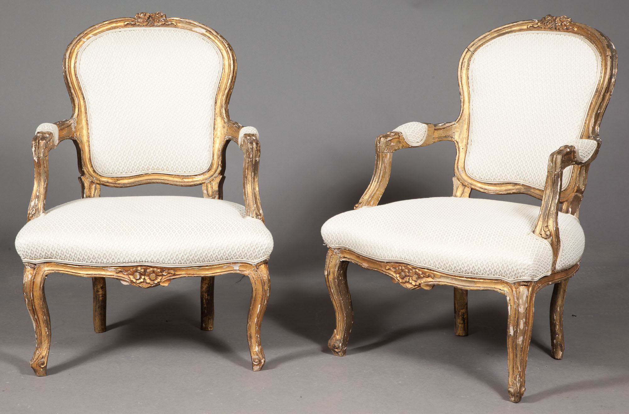 Lot image - Pair of Continental Rococo Style Giltwood Armchairs
