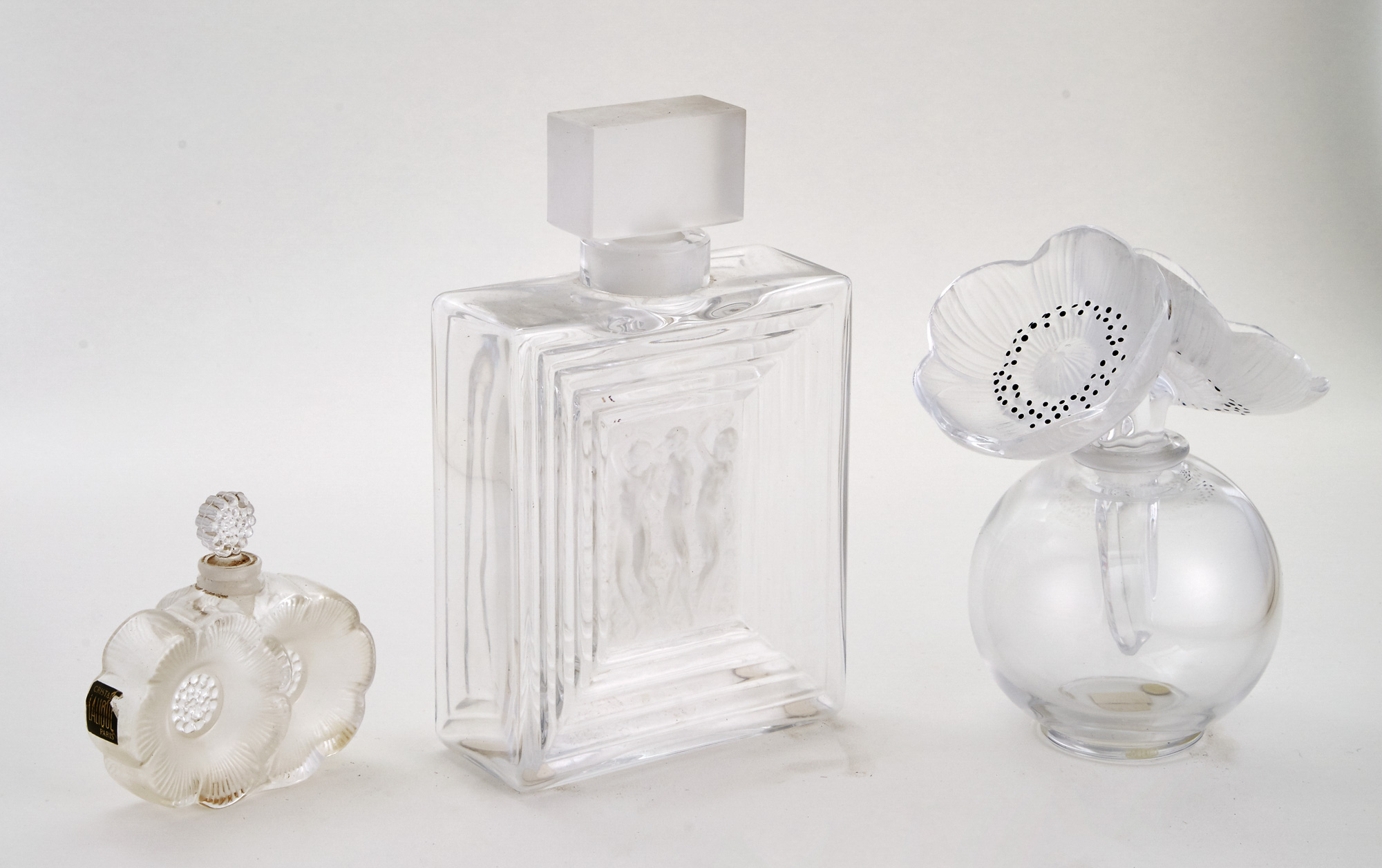 Lot image - Three Lalique Molded Glass Perfume Bottles