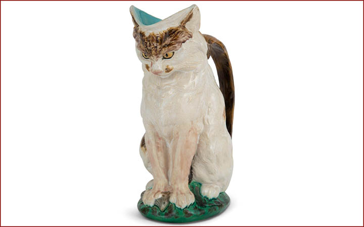The Joan Stacke Graham Majolica Collection Auction December 14 Lot 1048. Mintons Majolica Cat with Mouse Milk-Jug. Estimate: $2,500 - $3,500.
