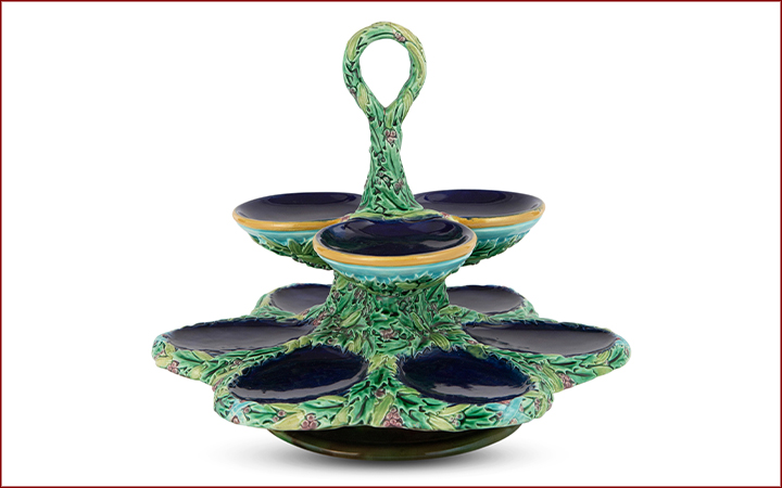 The Joan Stacke Graham Majolica Collection Auction December 14 Lot 1142. George Jones Majolica Two-Tiered Cobalt-Blue Ground Oyster Stand. Estimate: $1,500 - $2,500.