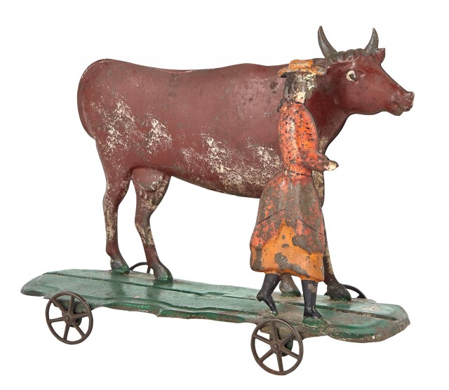 Woman and Cow Tin Toy