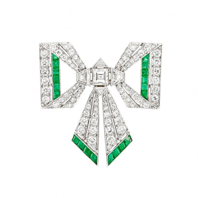 Platinum, Diamond and Emerald Bow Pin, France, circa 1920. Sold for $3,438.